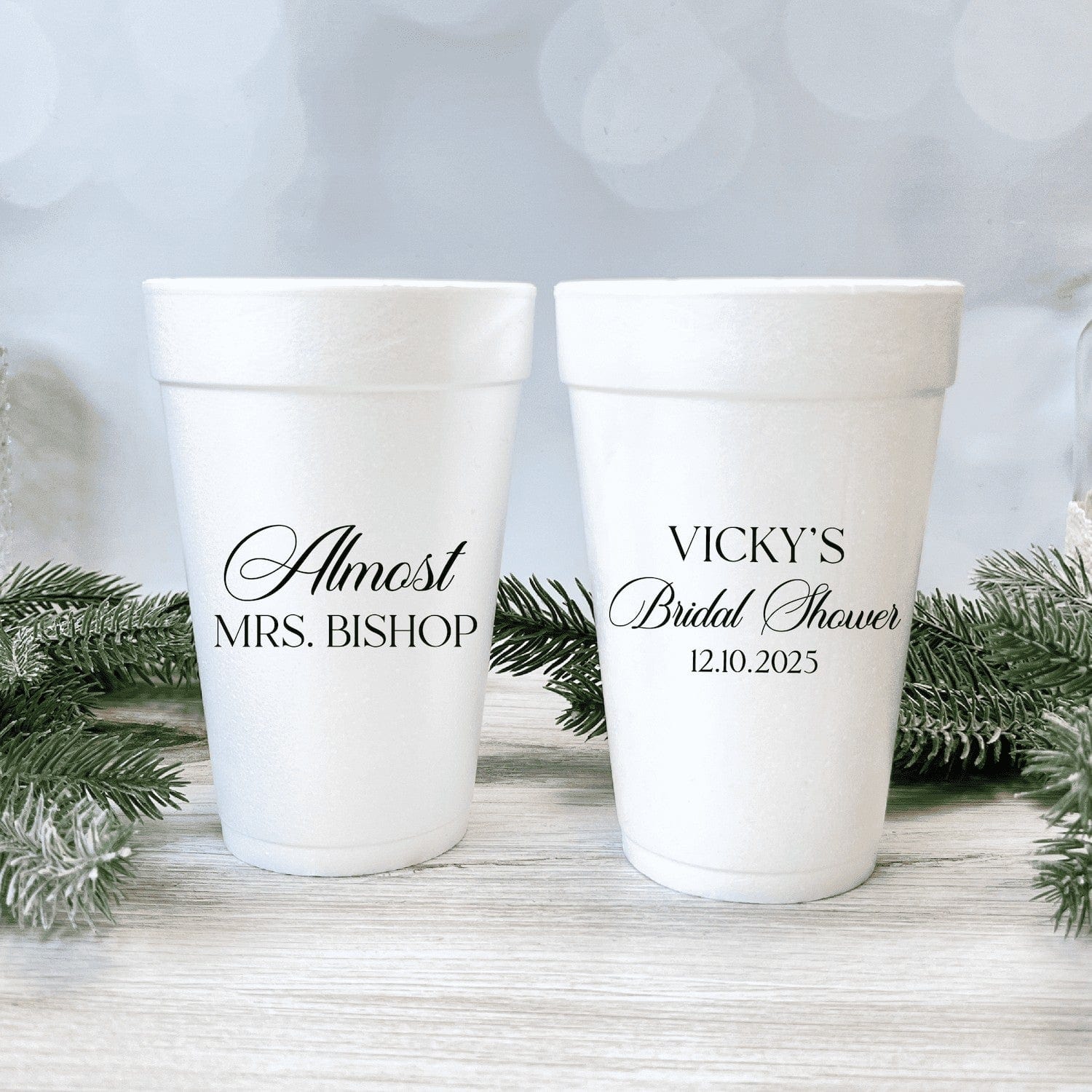 Customizable white foam cups featuring black script text, perfect for bridal shower party favors or beverages.