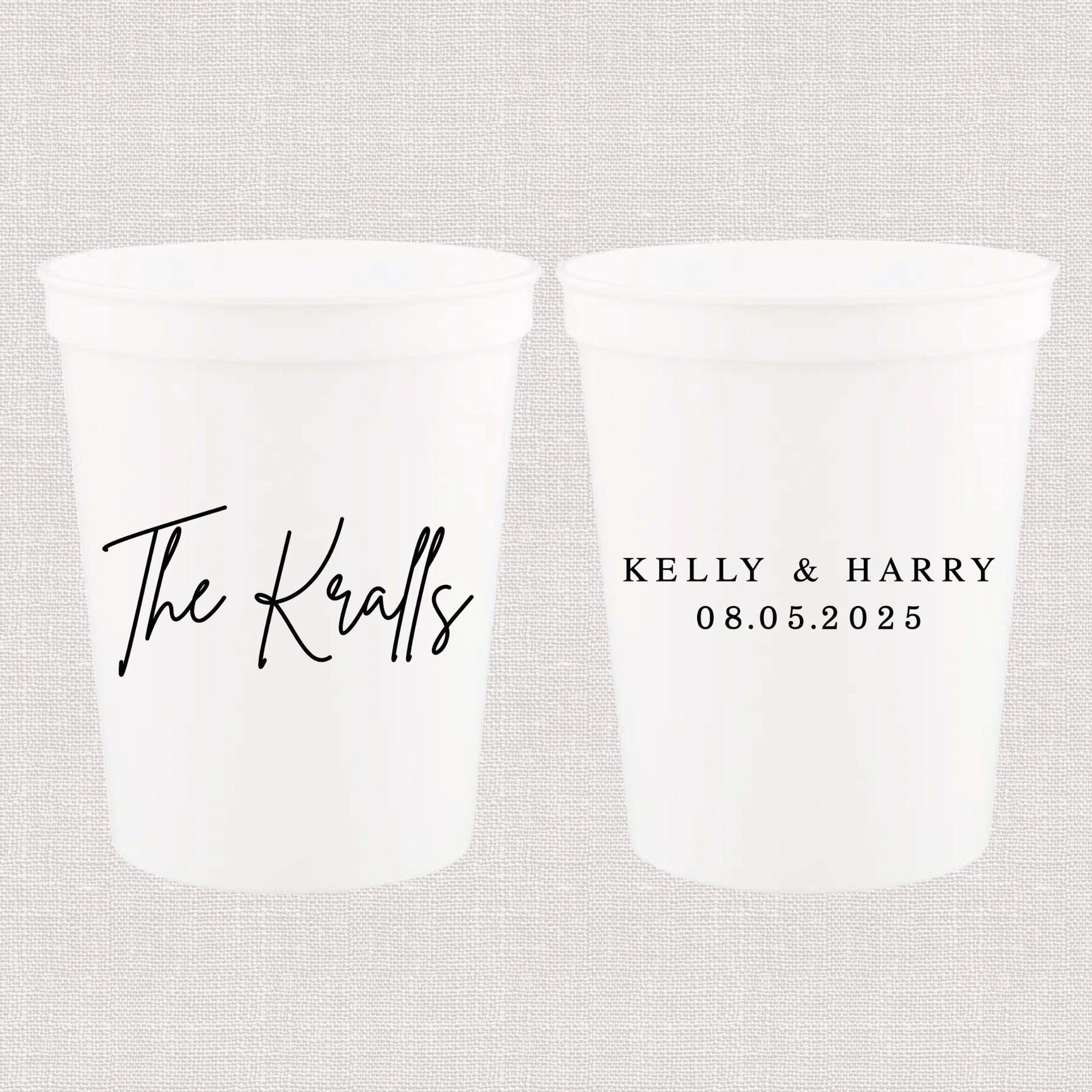 Two white frosted stadium cups with "The Kralls" in script on front and "KELLY & HARRY 08.05.2025" on back.