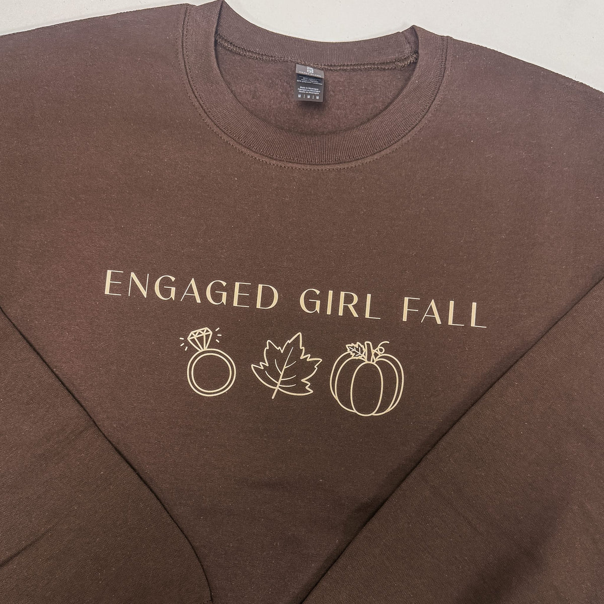 Engaged Girl Fall sweatshirt print detail in ivory cream on a brown crewneck