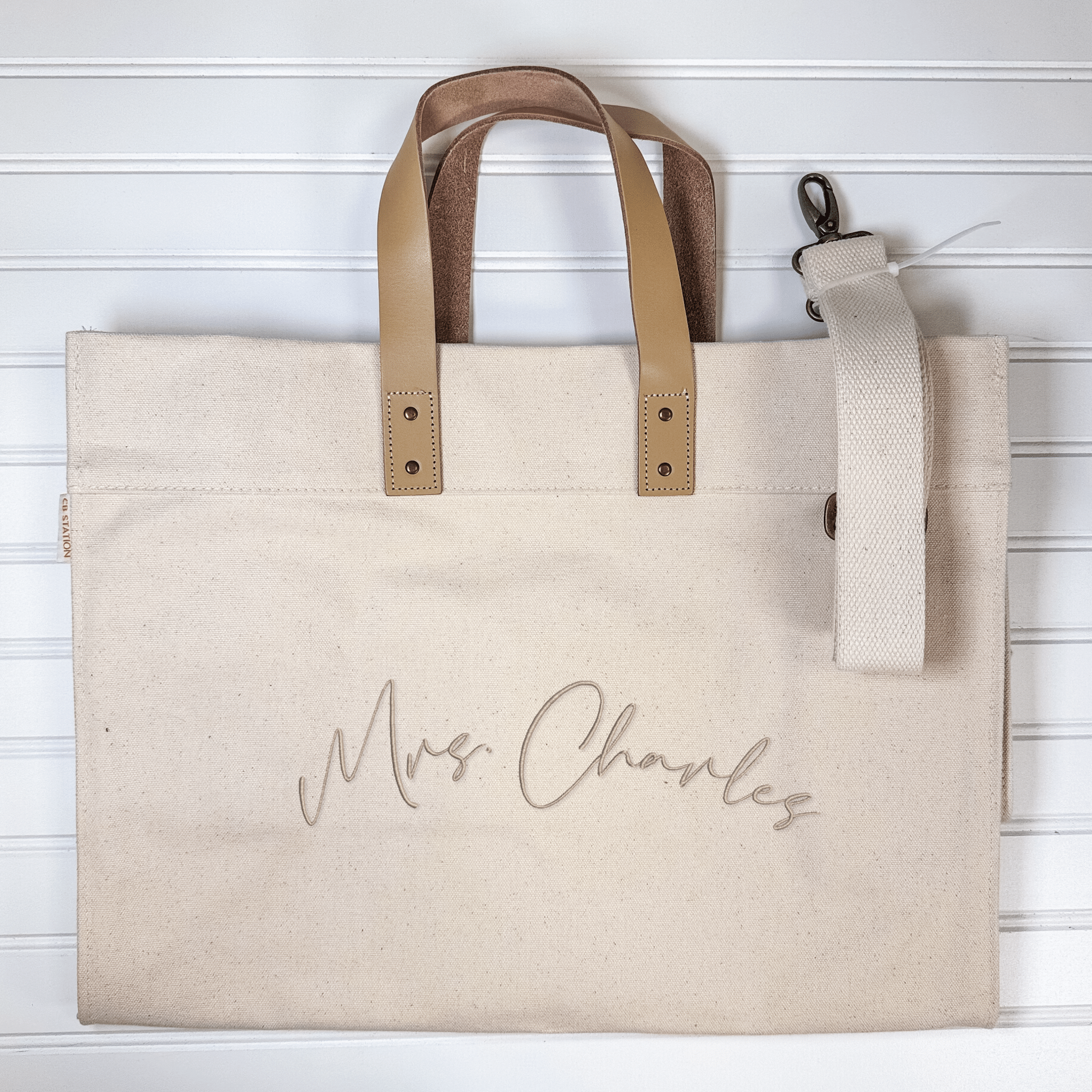 Monogrammed canvas tote with genuine leather handles