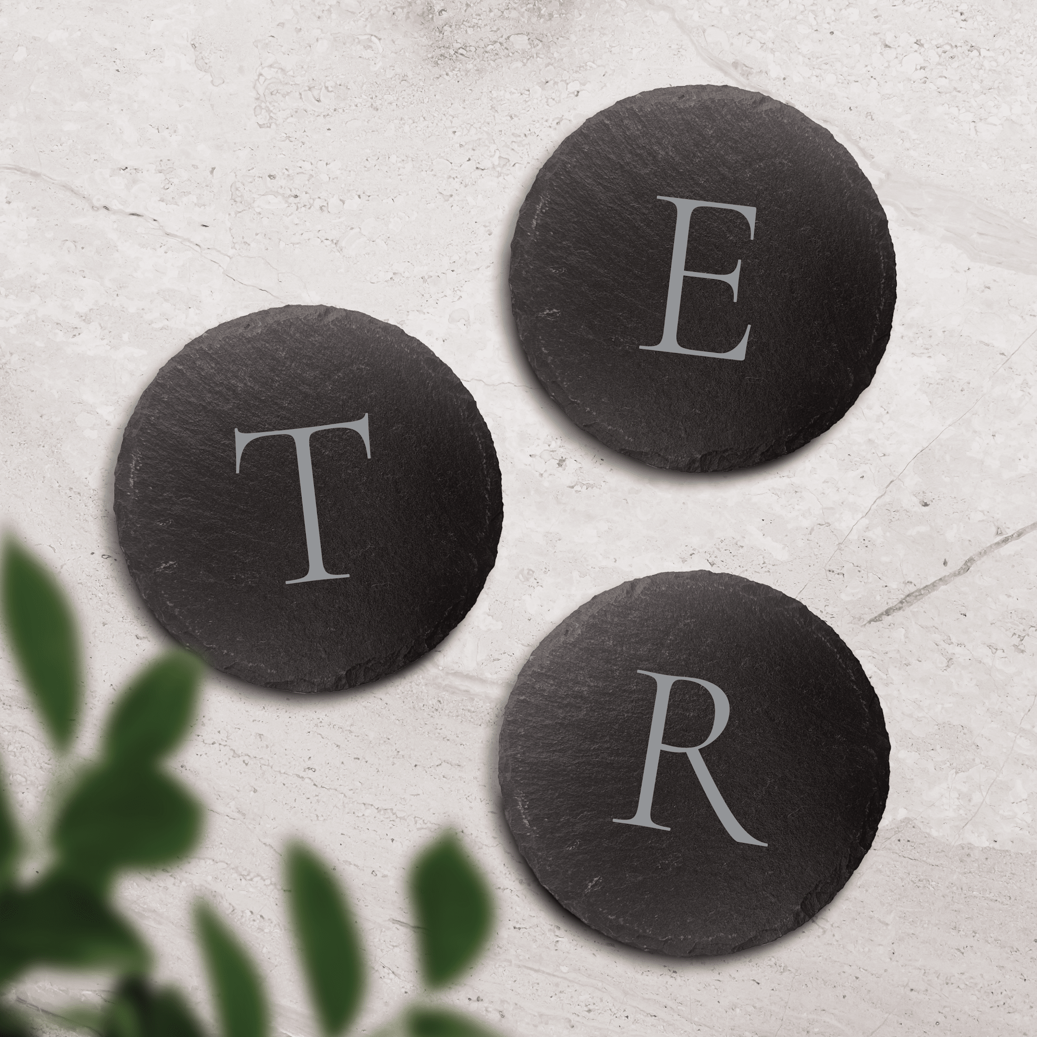 Round monogram slate coaster set engraved with single initials