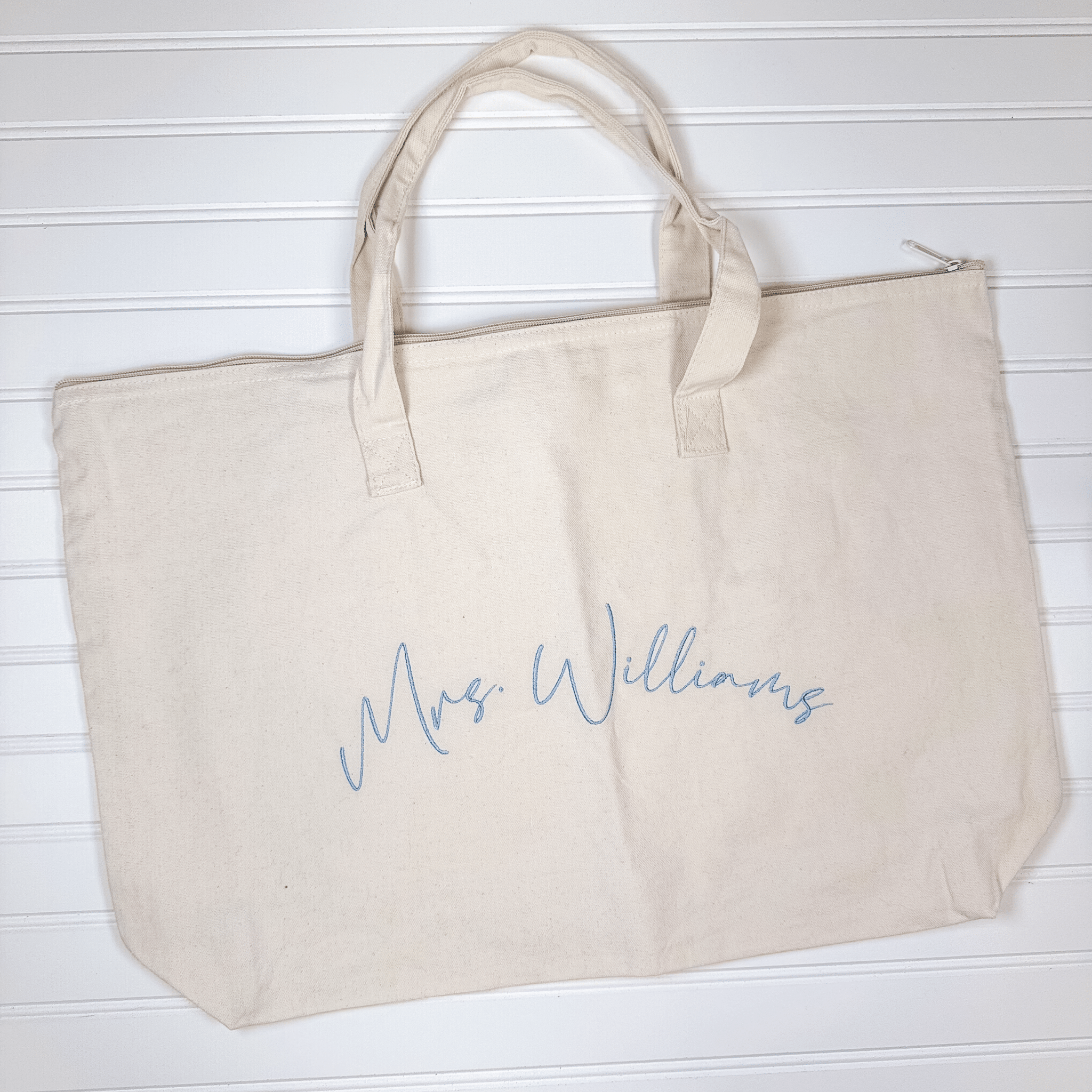 Personalized zippered canvas tote bag with Mrs. last name embroidery
