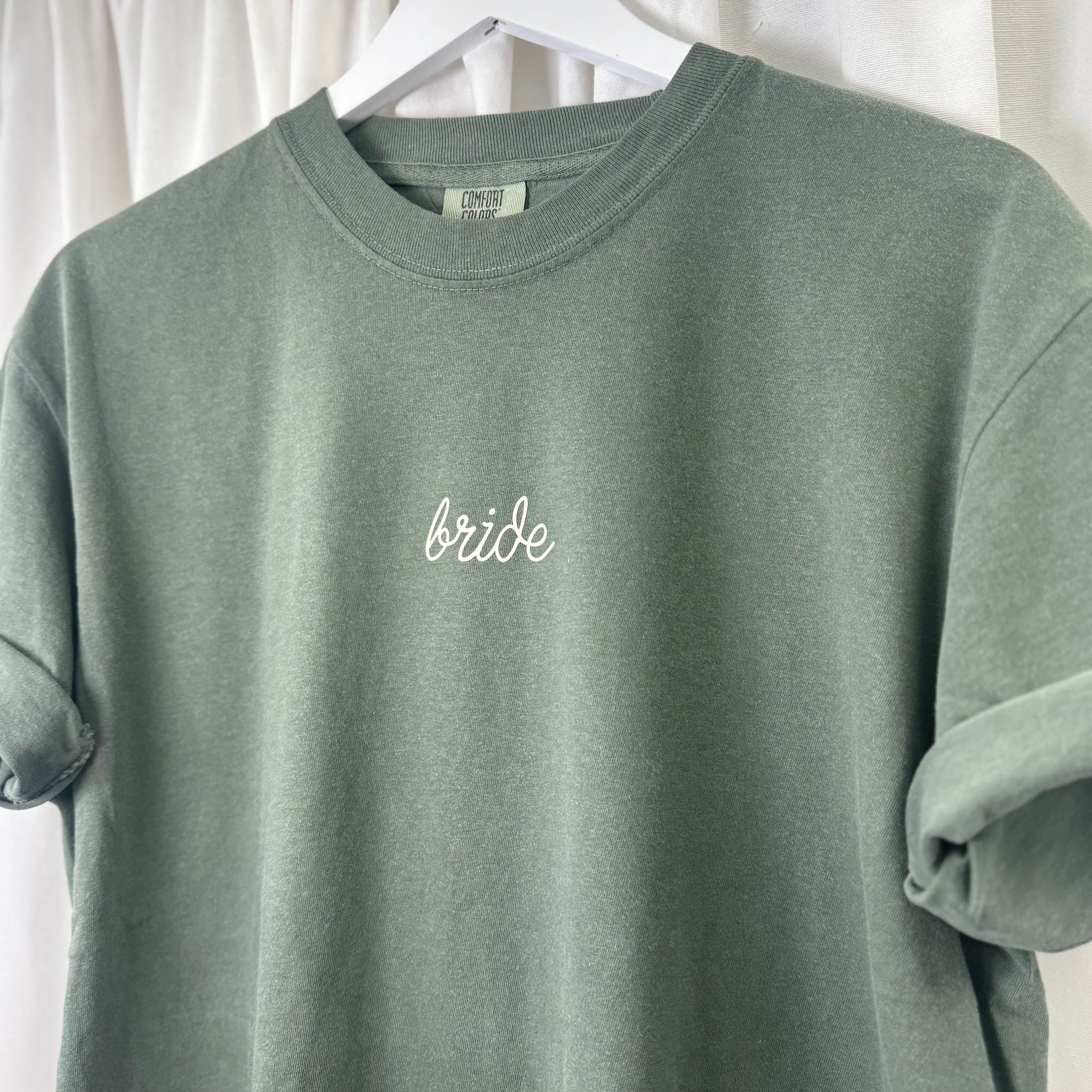 Hunter green embroidered Bride t-shirt, side detail showing sleeve and collar of Comfort Colors 1717