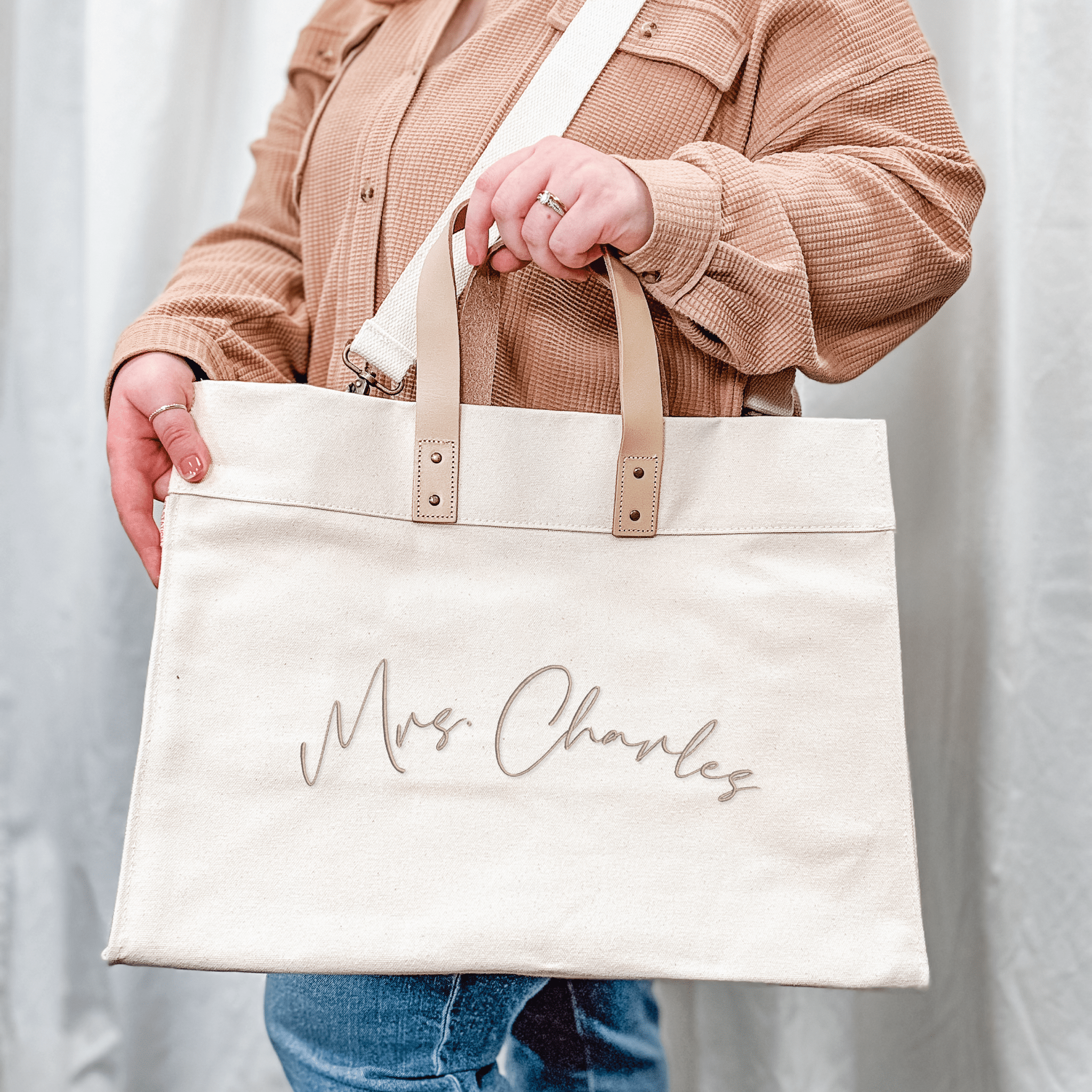 Personalized canvas tote showing interior side pockets