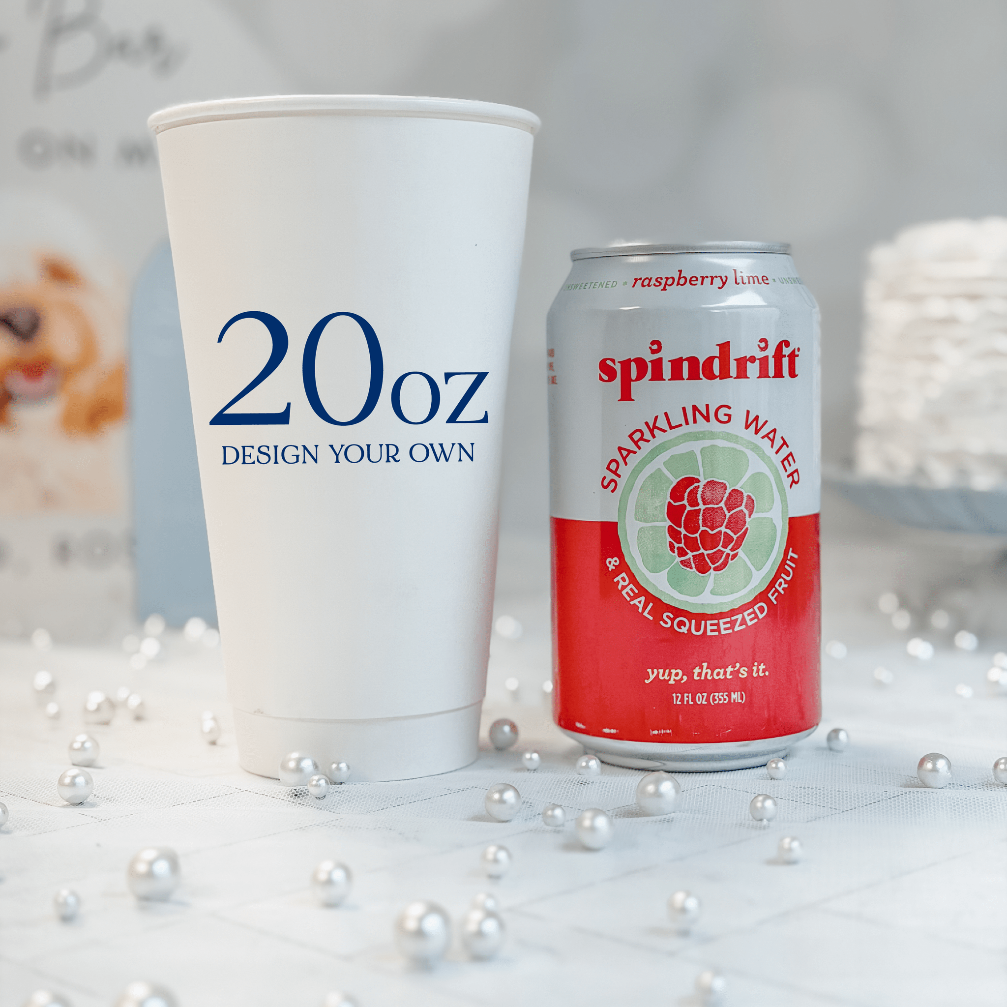 20 oz white paper cup compared to a 12 oz can for size reference, custom navy design