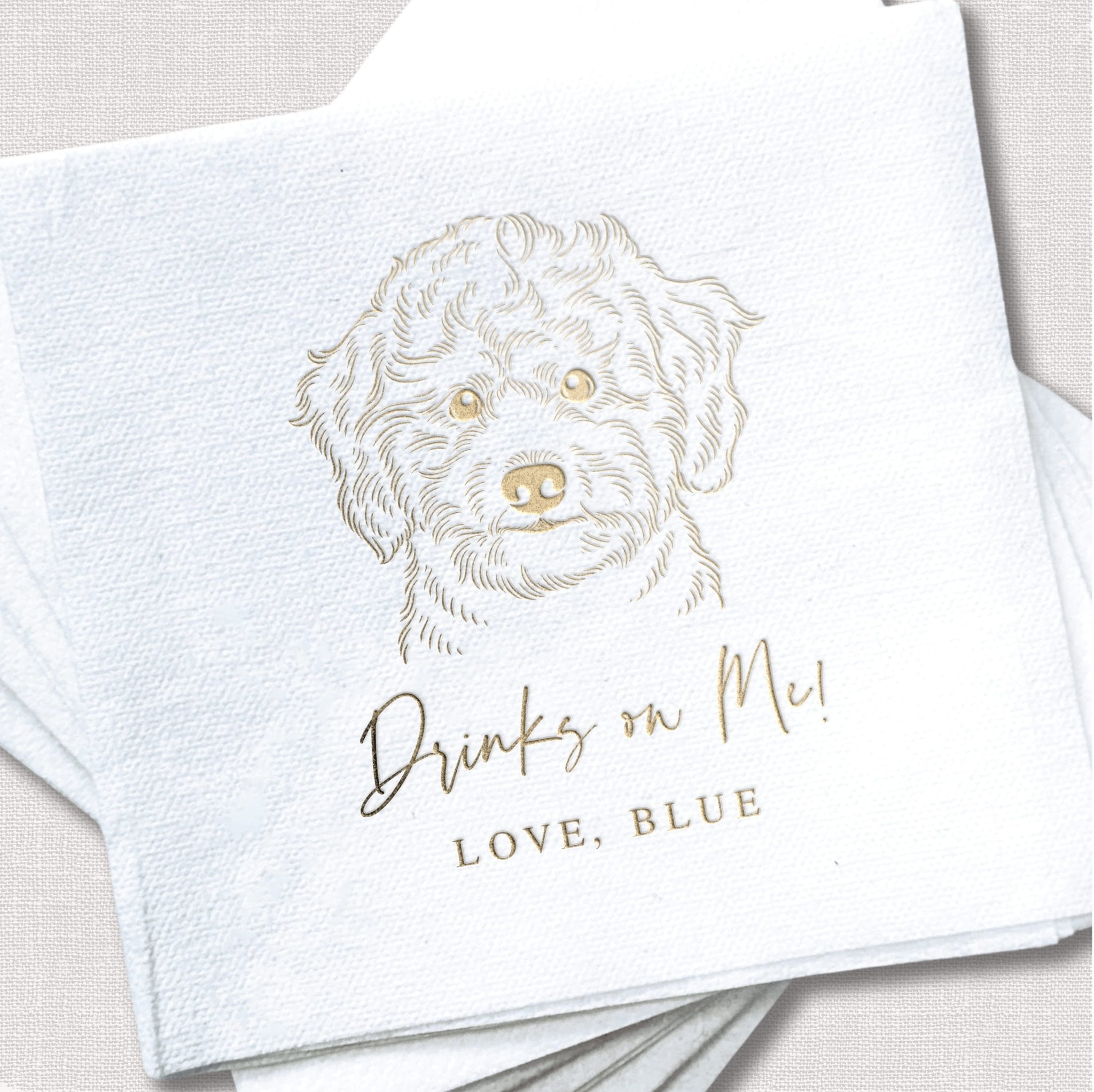 White napkin with golden dog portrait sketch and personalized text "Drinks on Me, Love, Blue" in foil stamping.