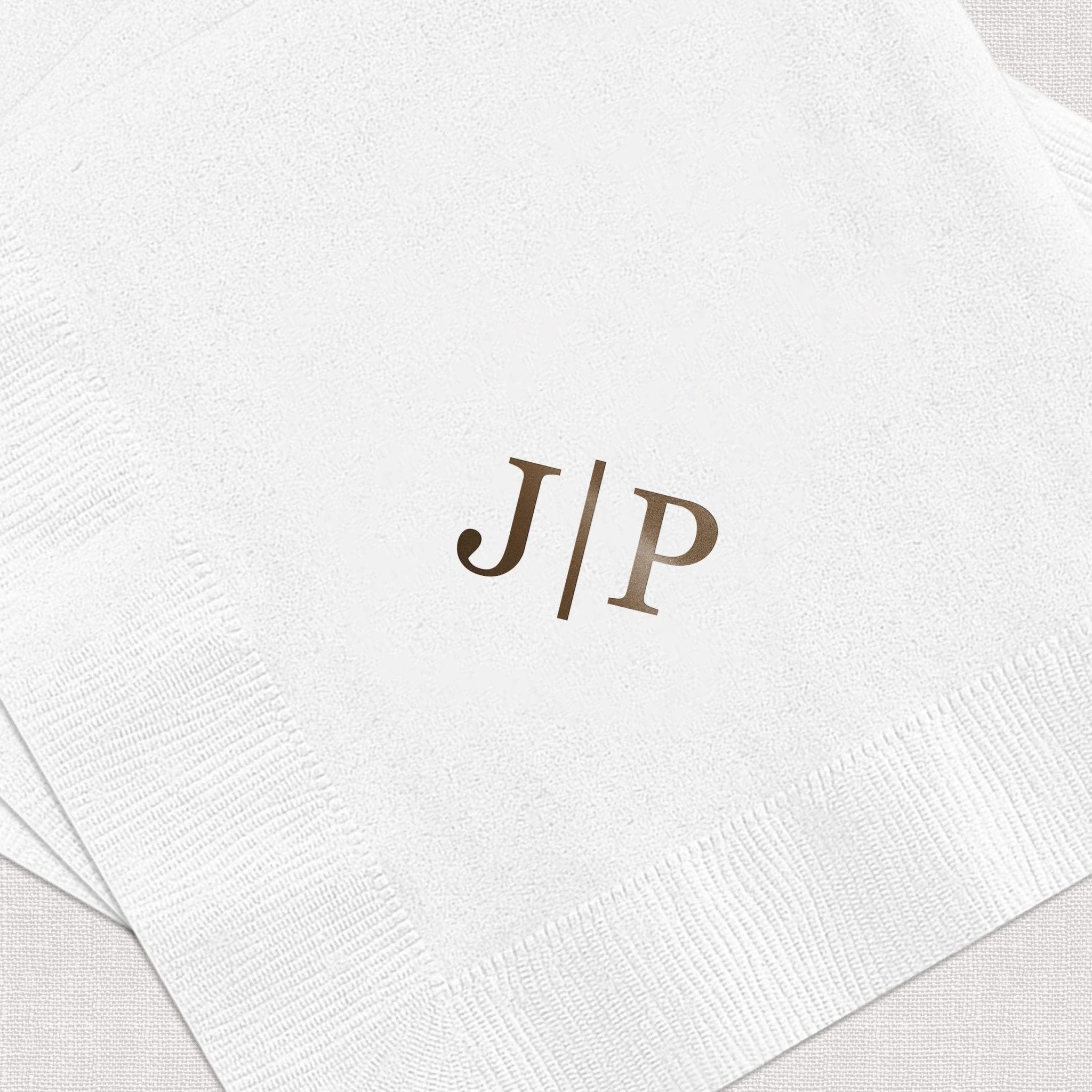 White napkin with brown foil stamped monogram J/P initials