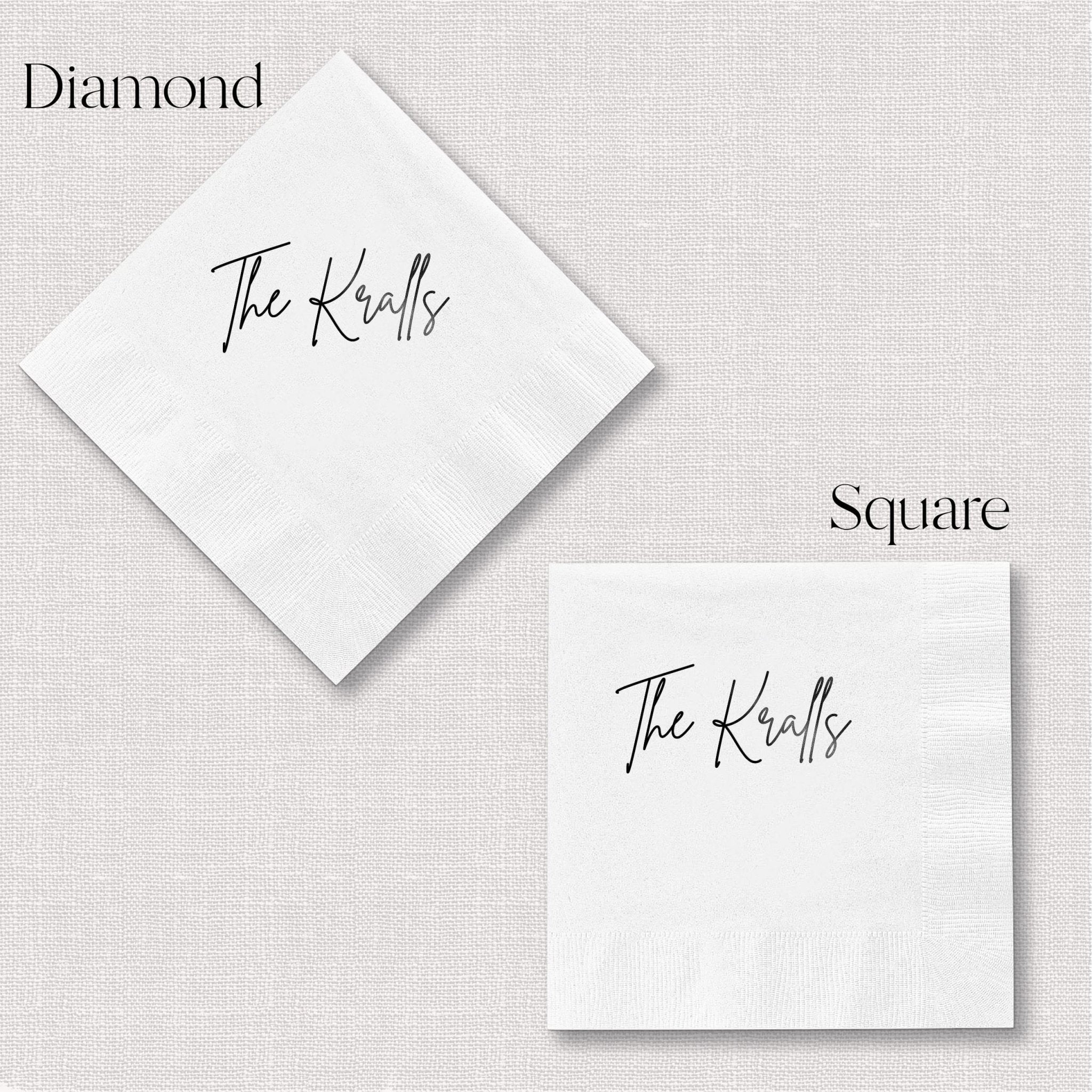 White foil-stamped cocktail napkins in diamond and square shapes personalized with "The Knolls" in script lettering.