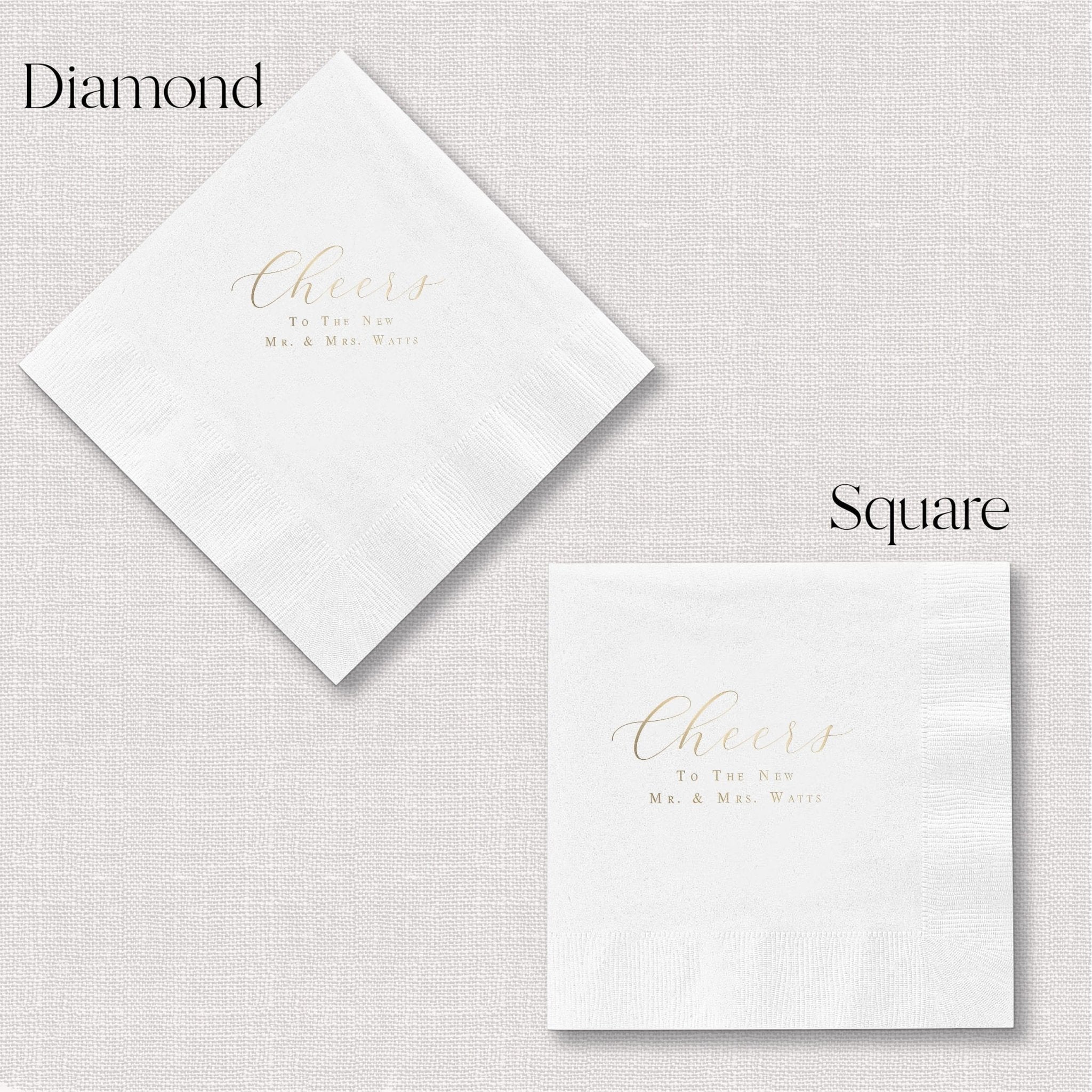 White napkins in diamond and square shapes with gold foil "Cheers to the Newlyweds" text and personalization details.
