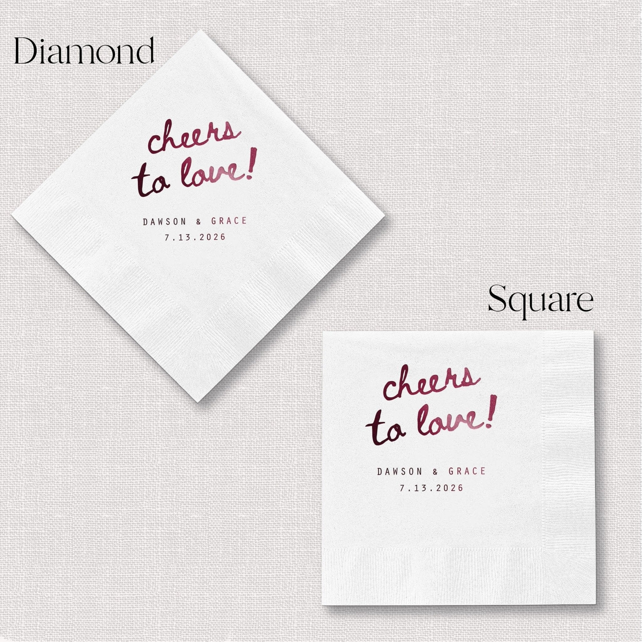 White napkins in diamond and square shapes with "cheers to love" text and personalized names and date in burgundy and black foil stamping.