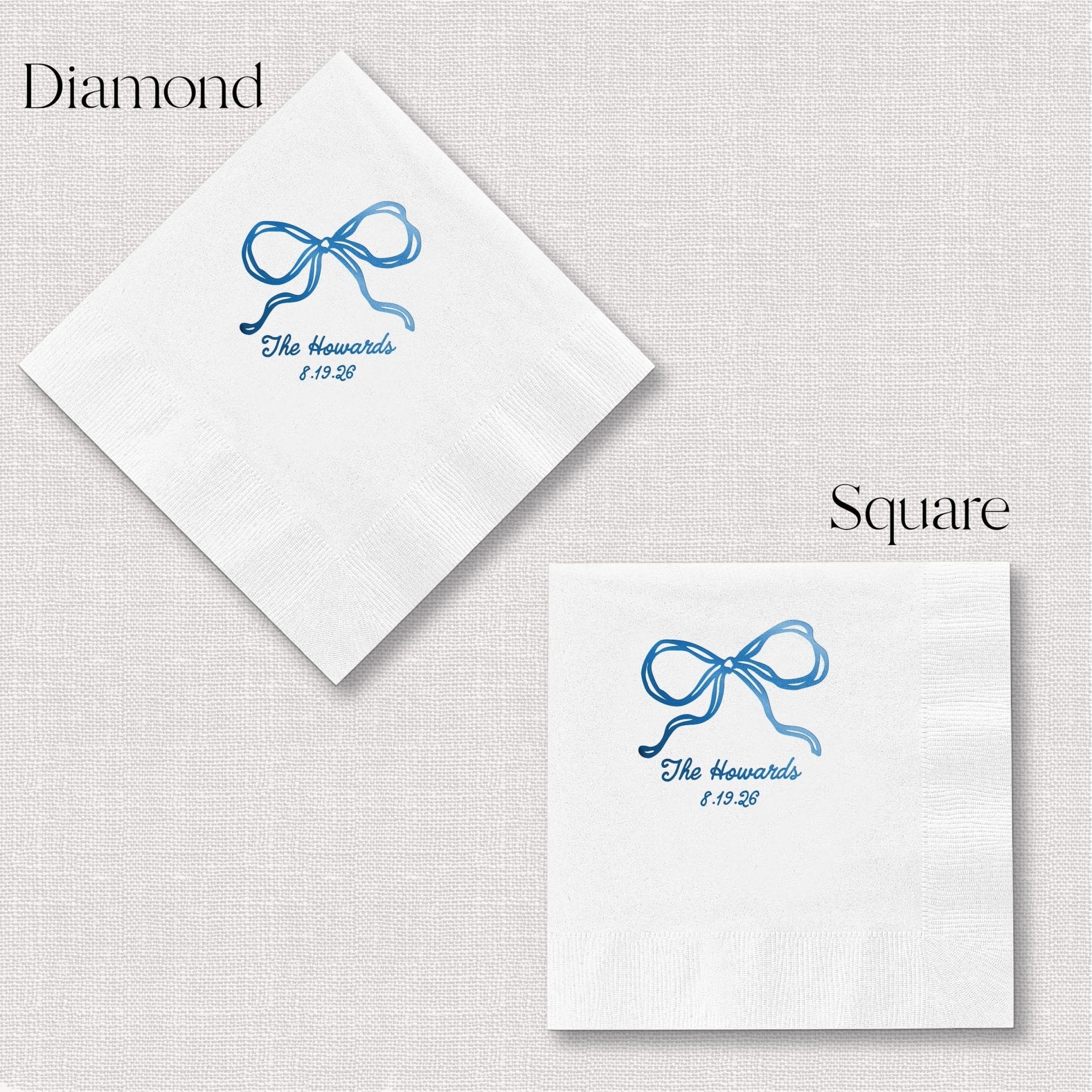 White cocktail napkins with blue foil-stamped bow design and personalized text in diamond and square shapes