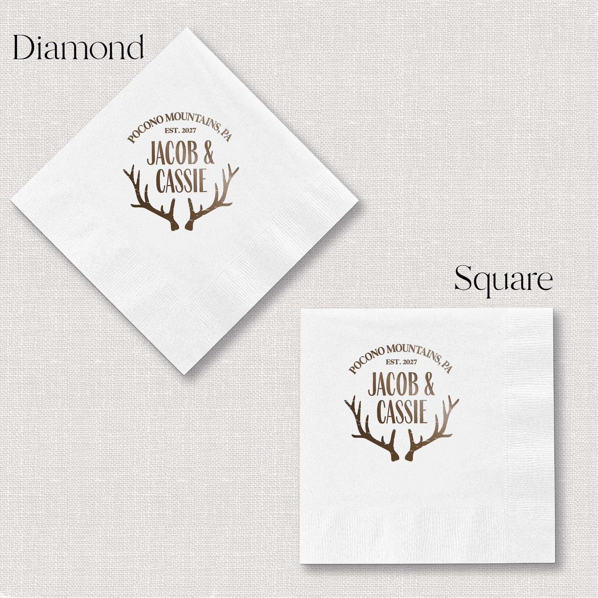 White napkins with personalized names Jacob and Cassie in antler design, shown in diamond and square folding styles