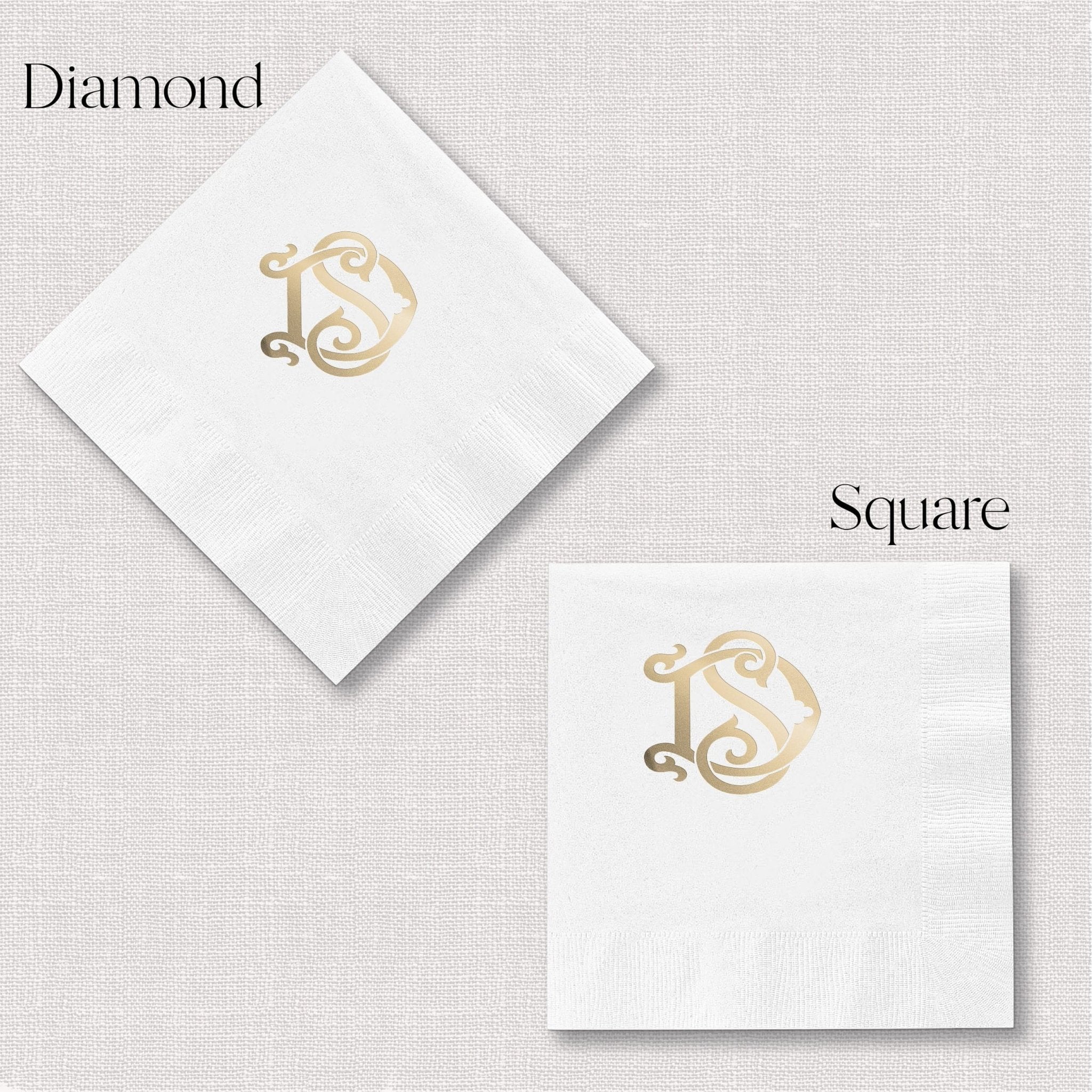 White napkins in diamond and square shapes with gold foil monogram design