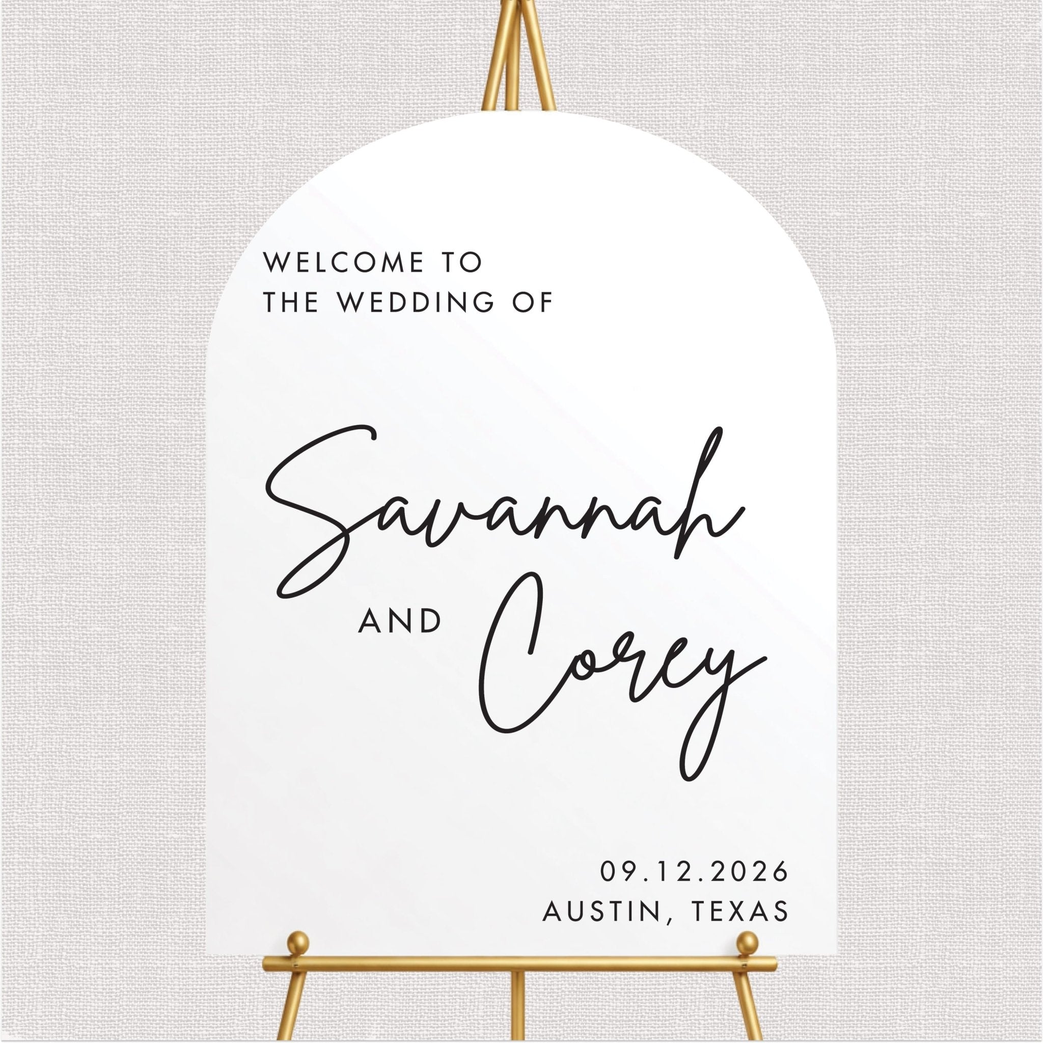 White wedding welcome sign with personalized couple names in script and wedding date text