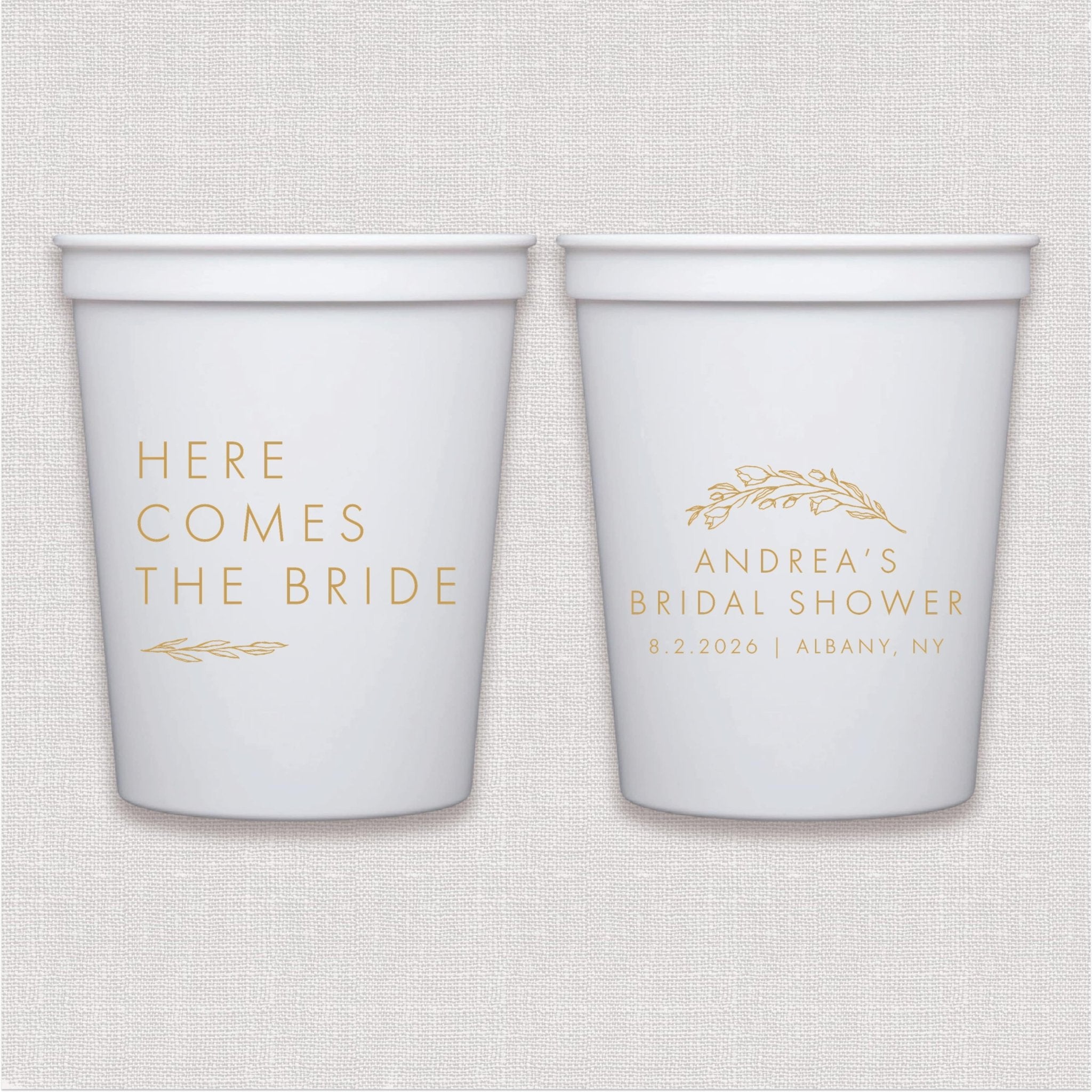 White stadium cups with gold foil personalized text text and floral leaf design