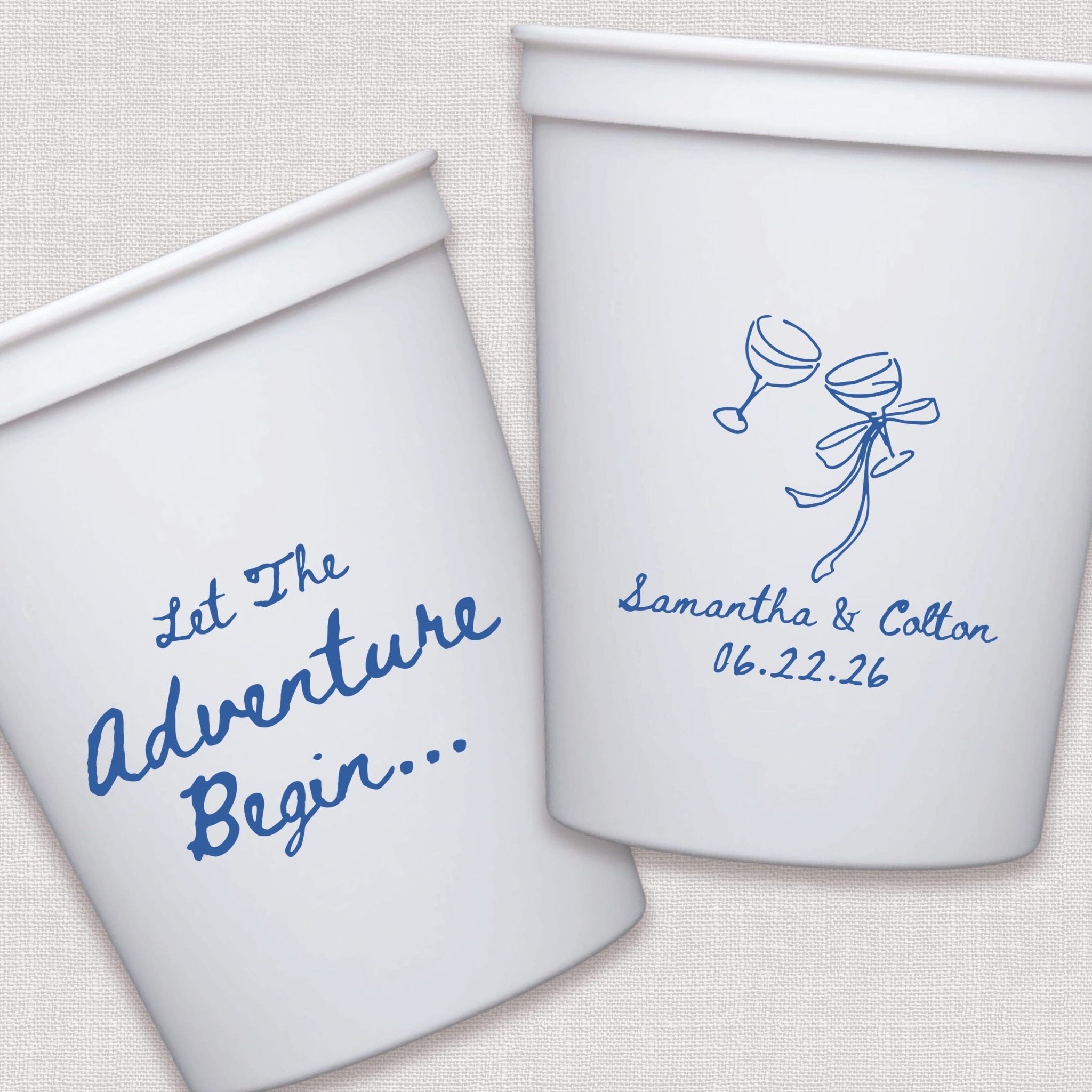 White stadium cups with blue script wedding text and balloon line art design