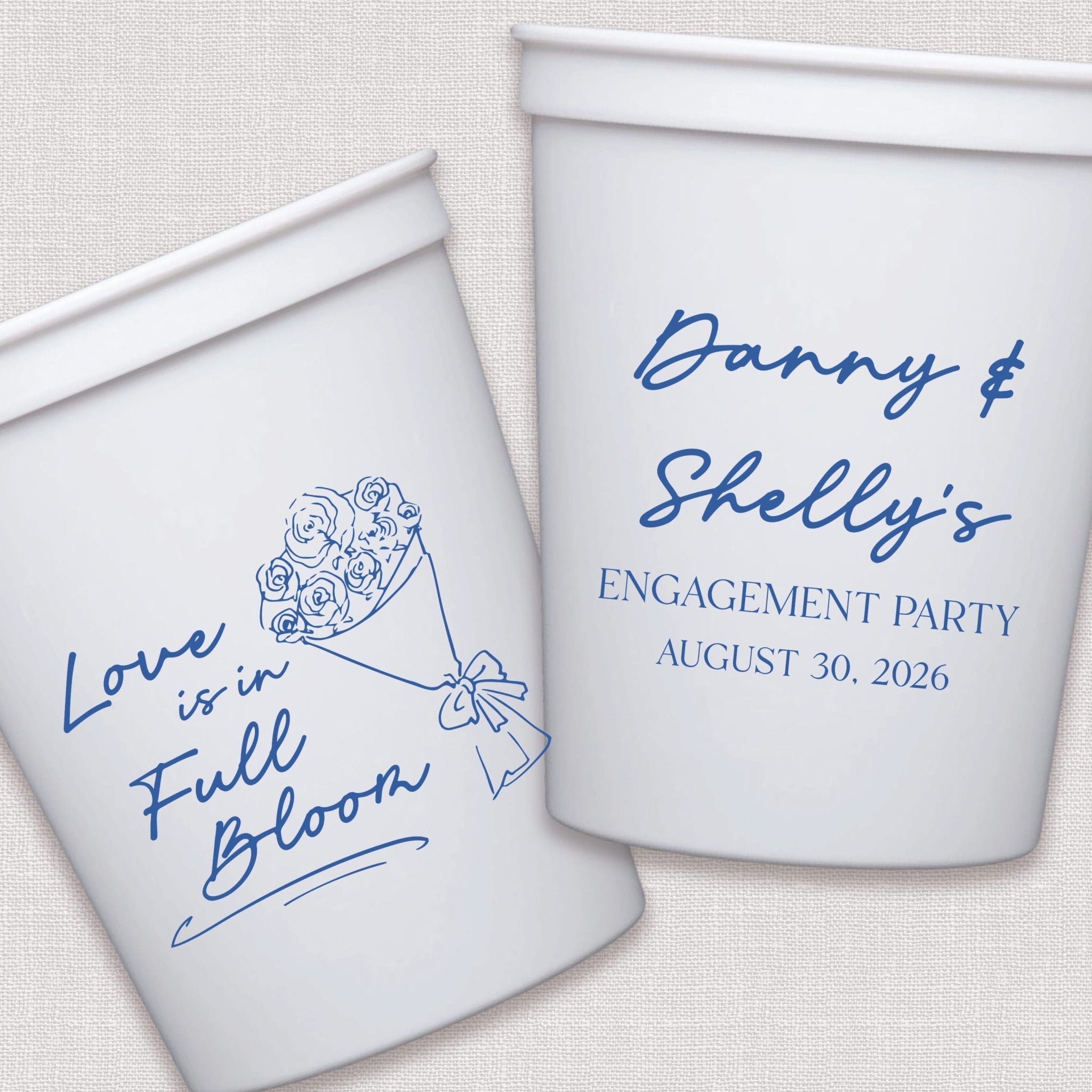 White stadium cups with blue floral bouquet and personalized engagement party text design