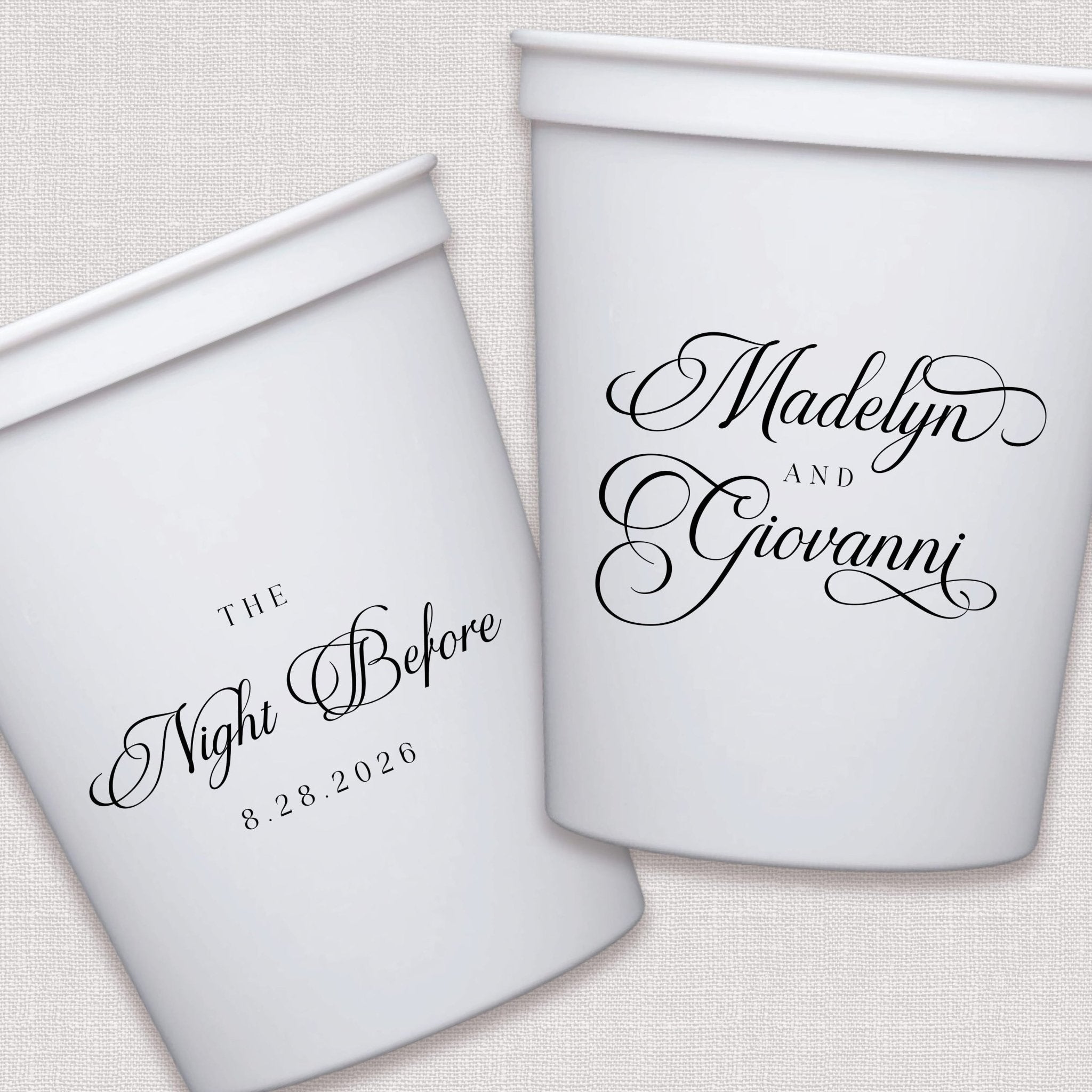 White stadium cups with elegant script wedding text and dates in black ink