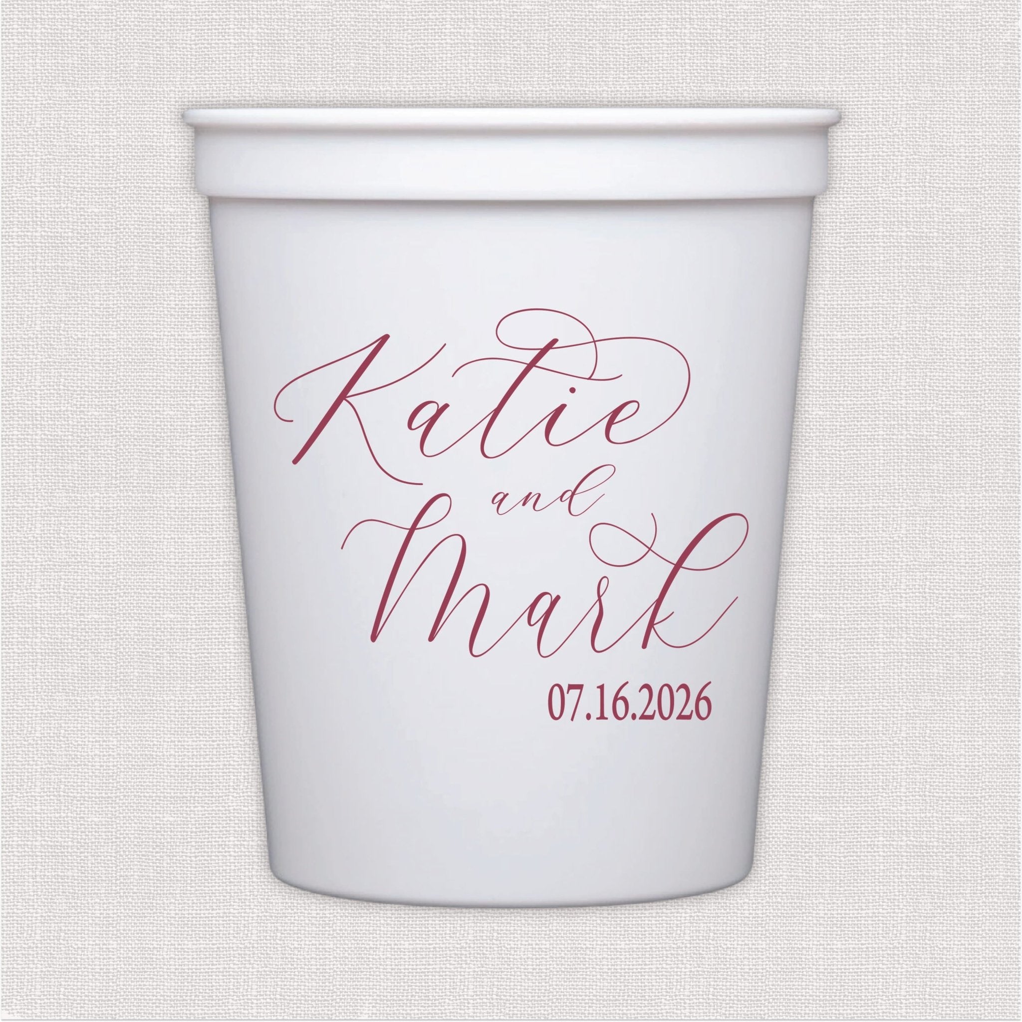 White stadium cup with personalized wedding text in script font and date in rose pink print