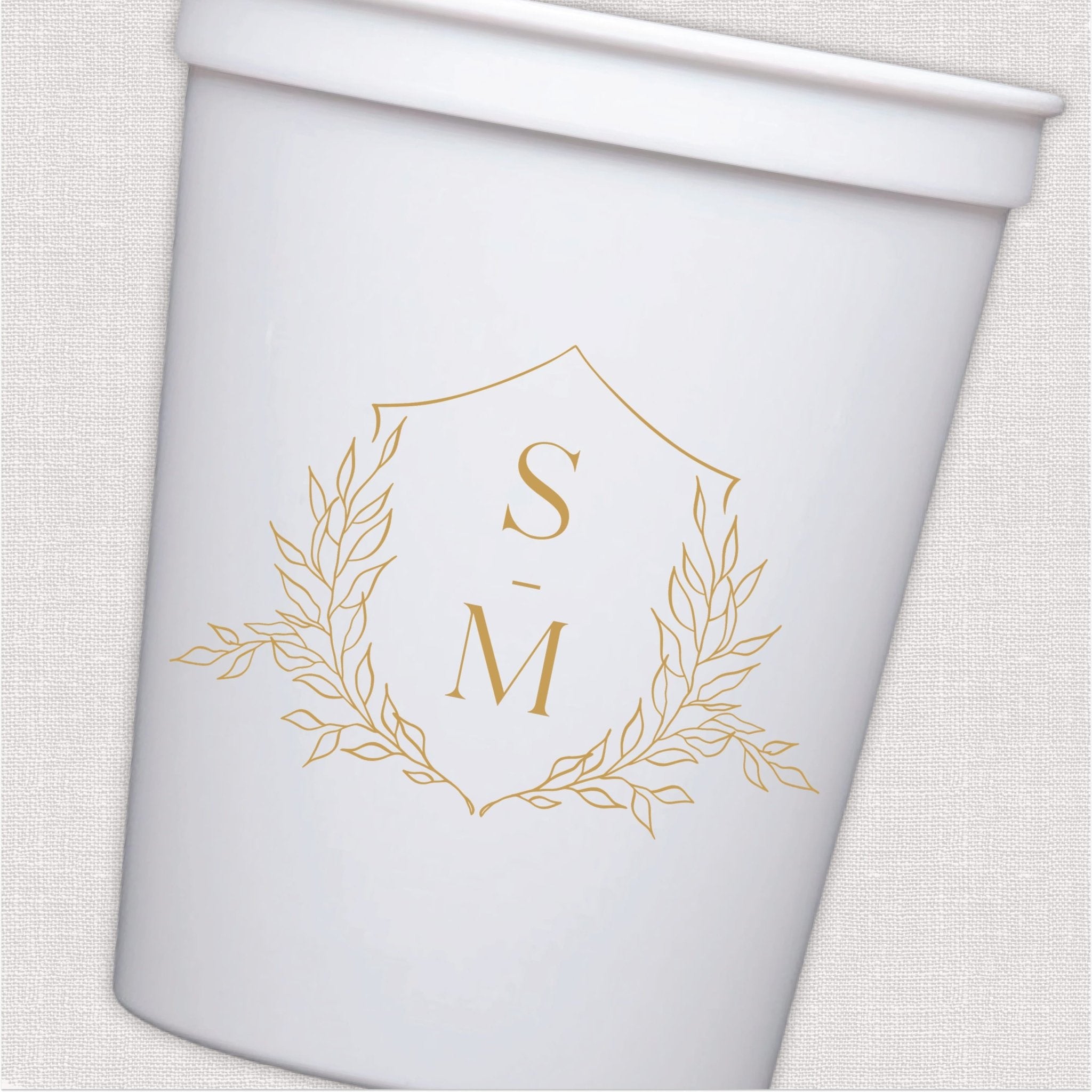 White stadium cup with gold monogram and laurel wreath wedding design
