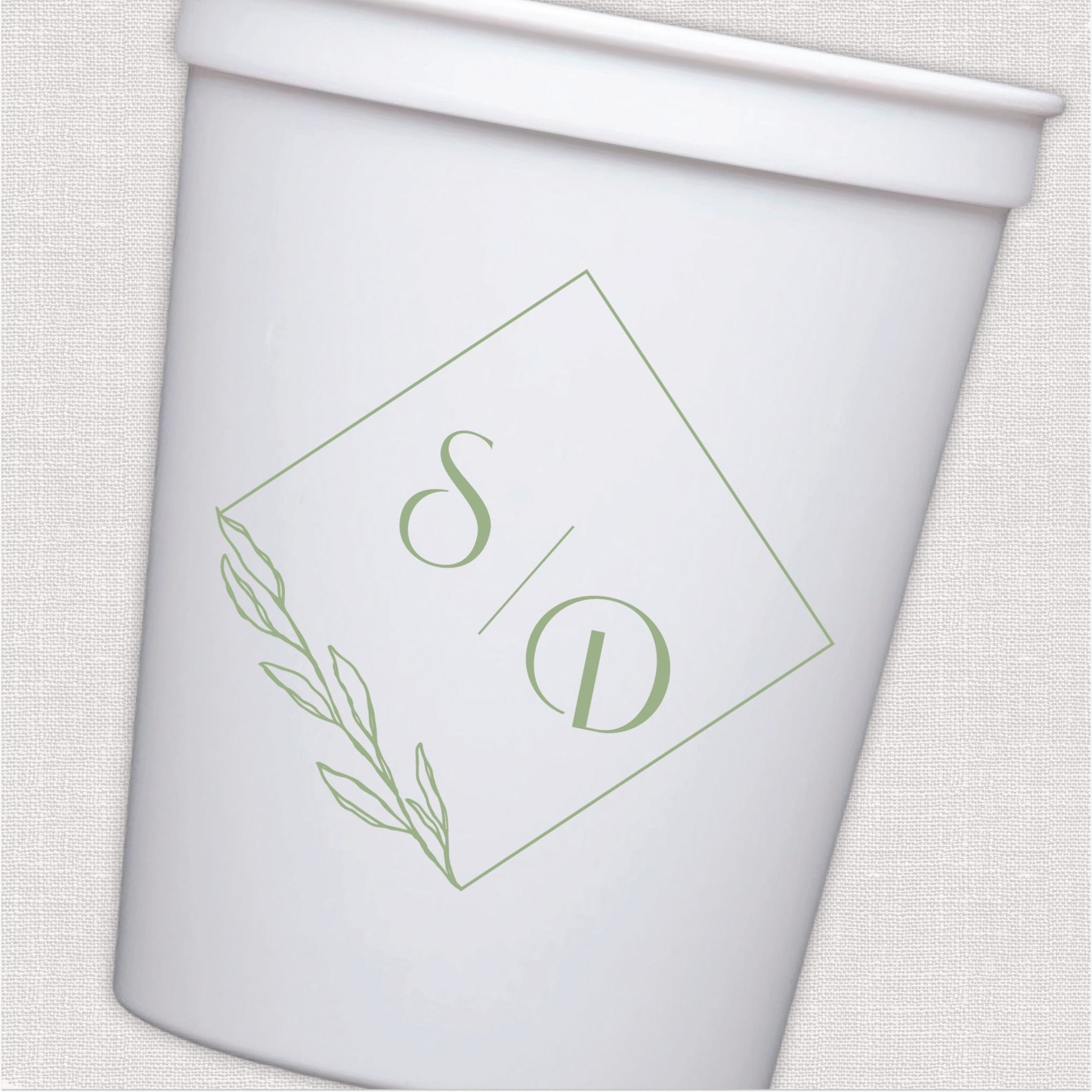 White stadium cup with sage green monogram design and leaf wreath
