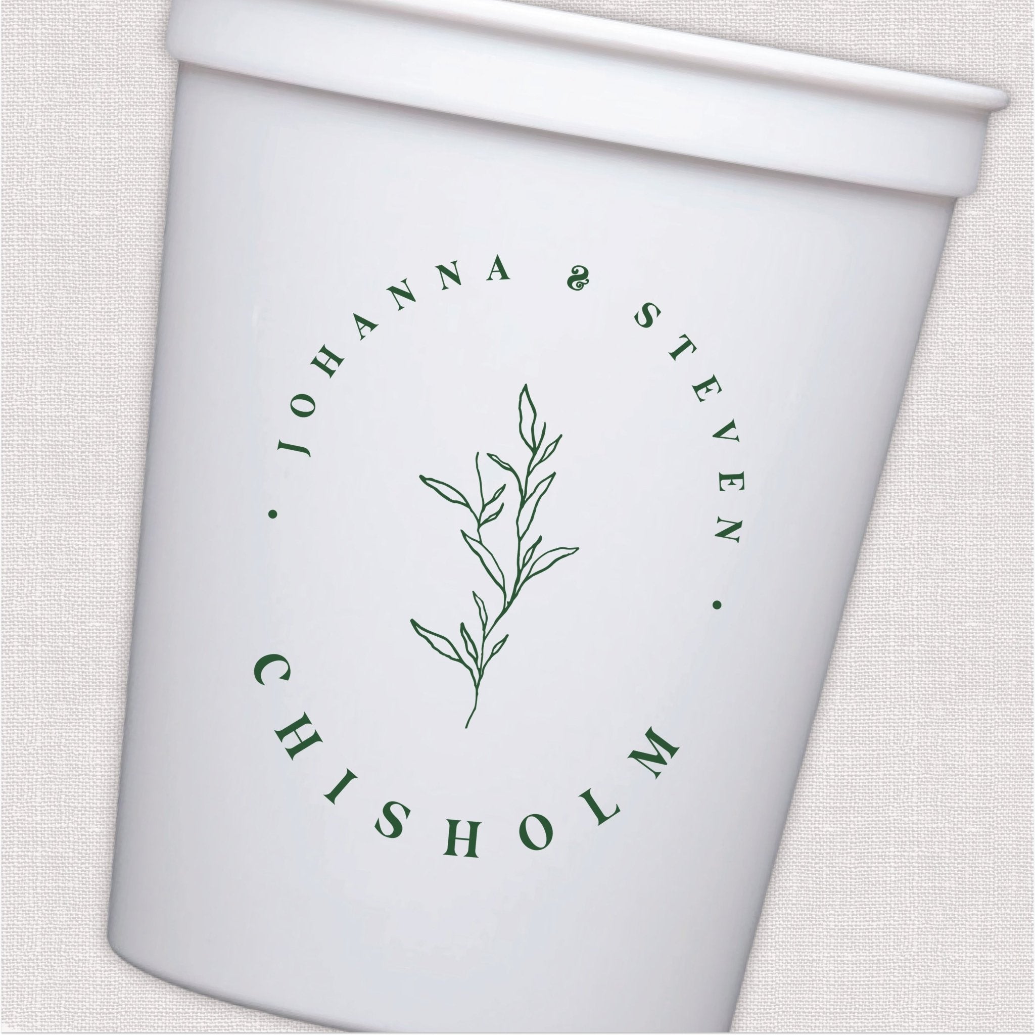 White stadium cup with sage green botanical leaf design and personalized wedding text in circular layout.