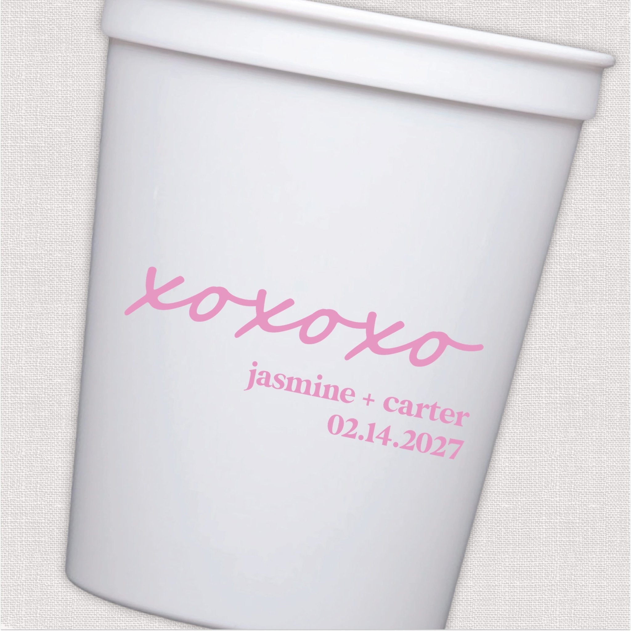 White stadium cup with pink xoxo design and personalized wedding text