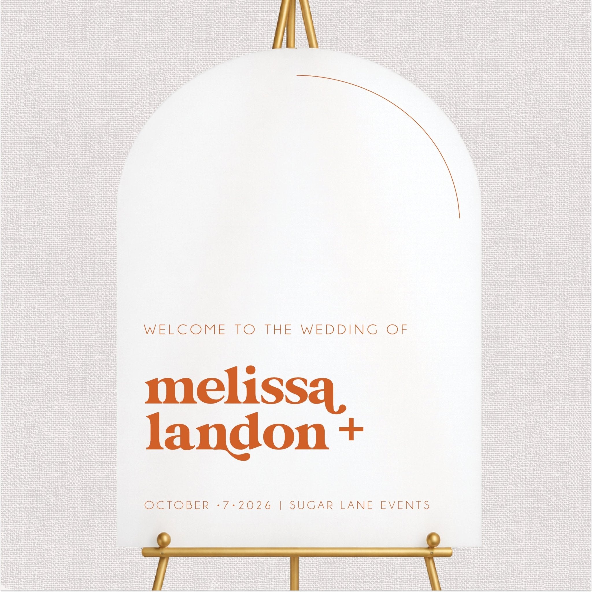 White welcome wedding sign with orange personalized couple text and gold accents