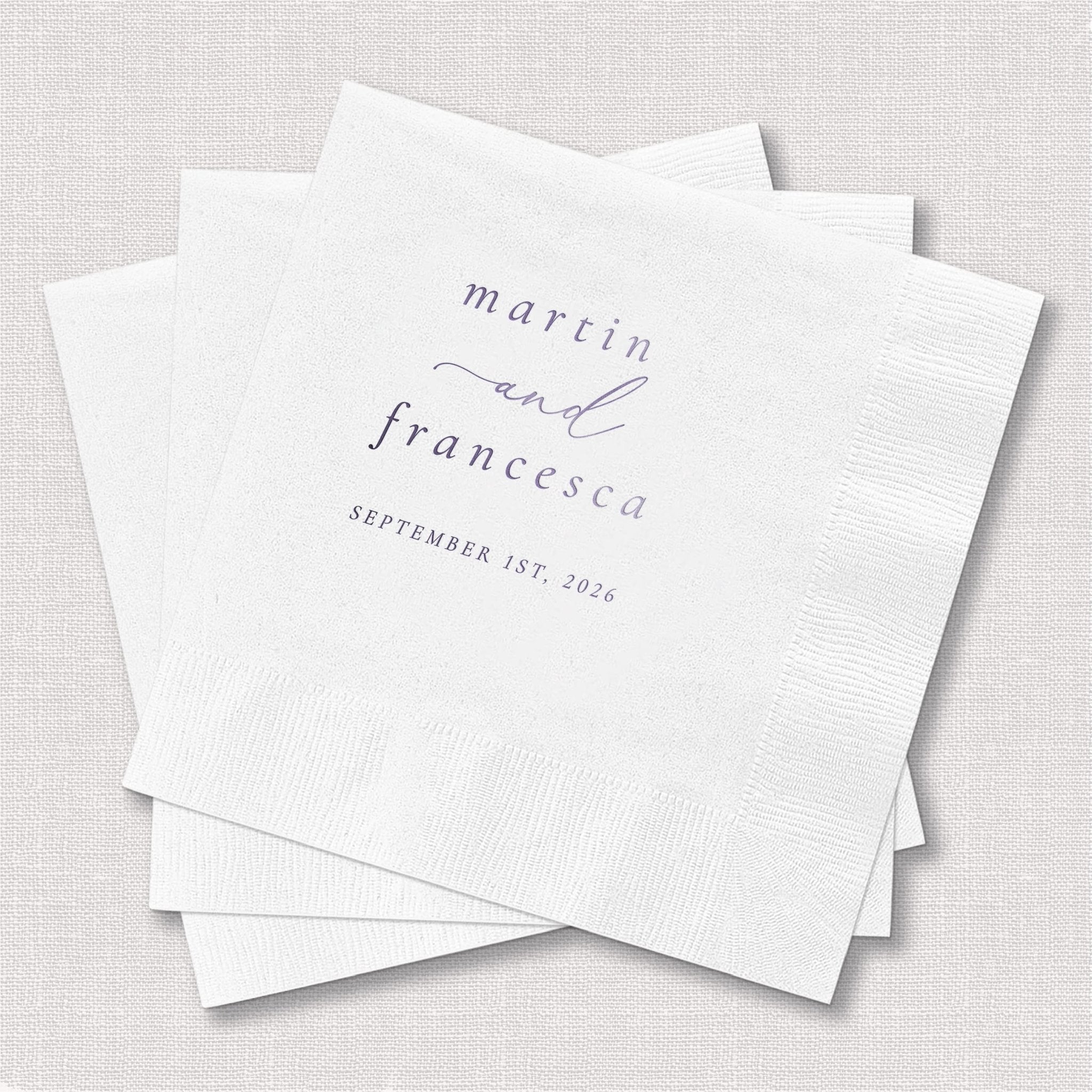 White foil-stamped napkins with "martin and francesca" in elegant script and "september 1st 2024" printed below.