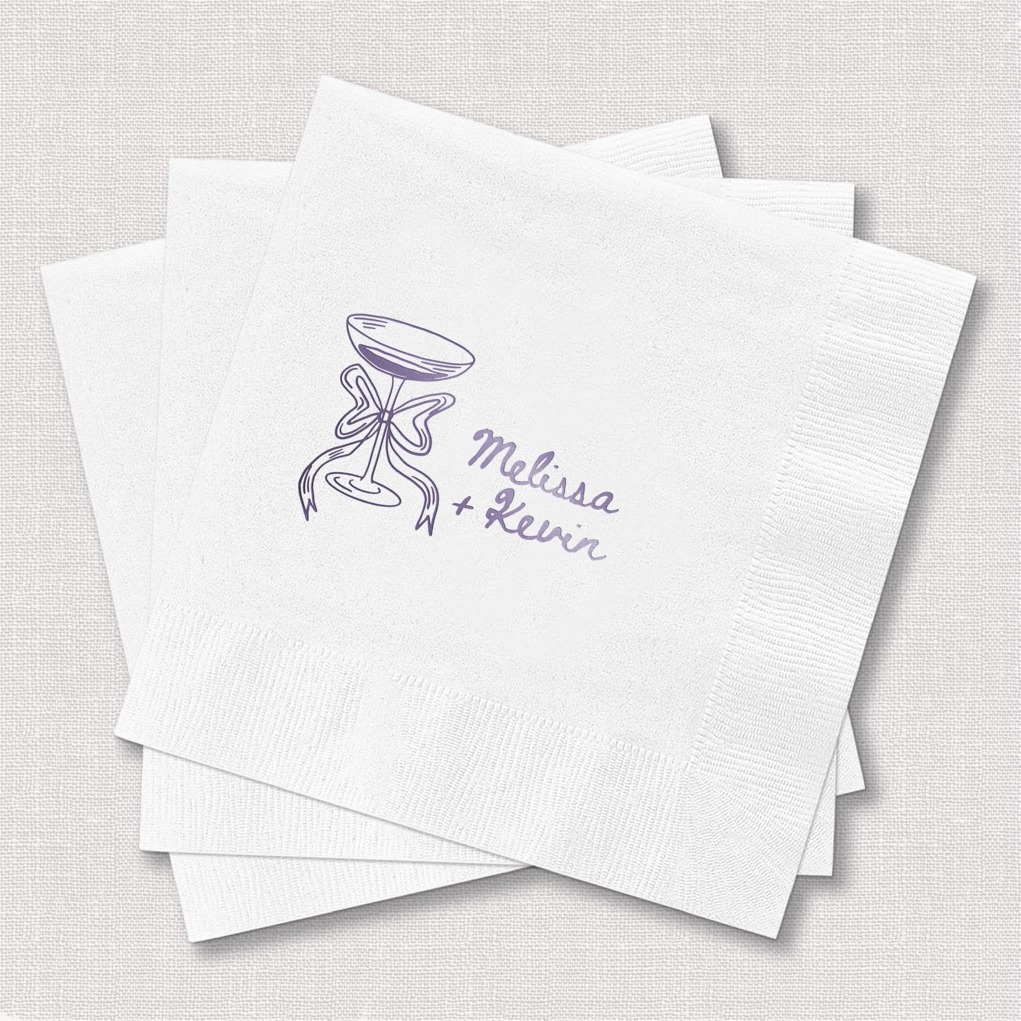 White cocktail napkins with purple champagne glass doodle and personalized names Melissa and Reese