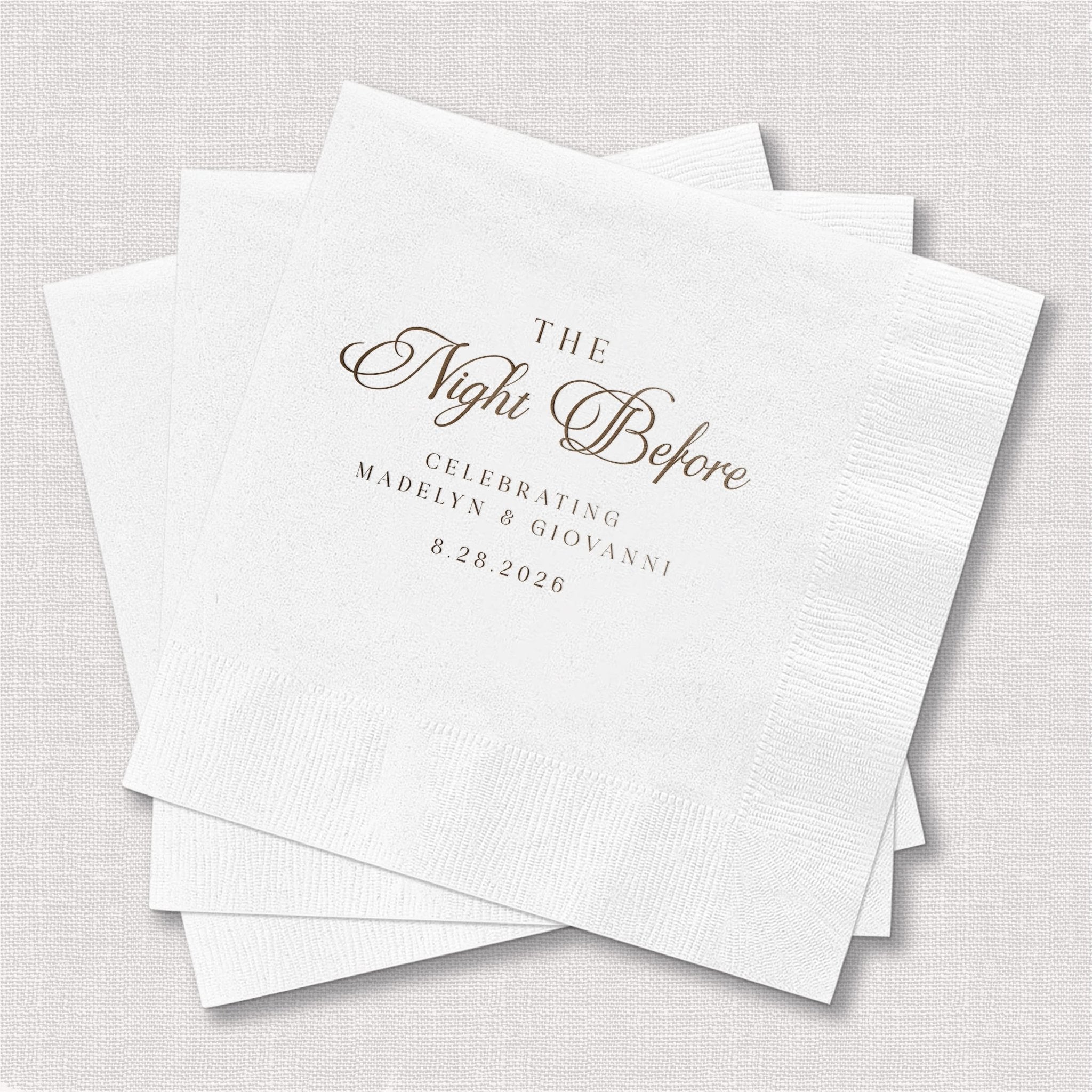 White cocktail napkins with "The Night Before" script text and personalized names and date in foil stamping