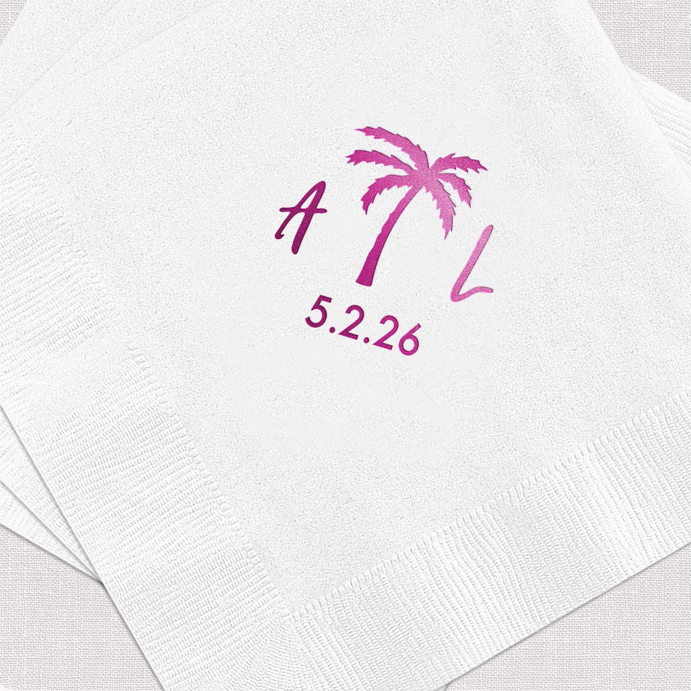 White cocktail napkins with magenta foil-stamped palm tree design and personalized initials and date