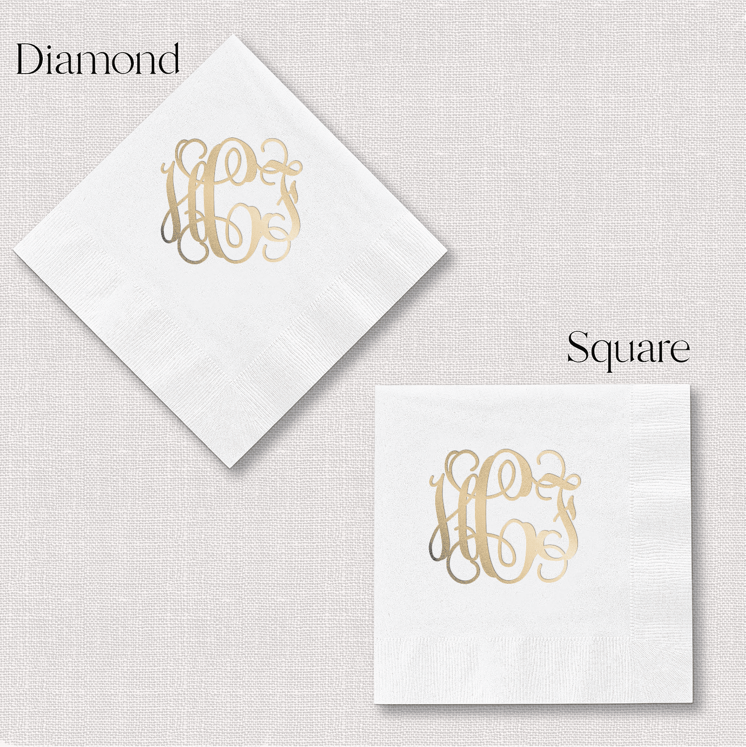 White napkins with gold foil monogram in diamond and square shapes