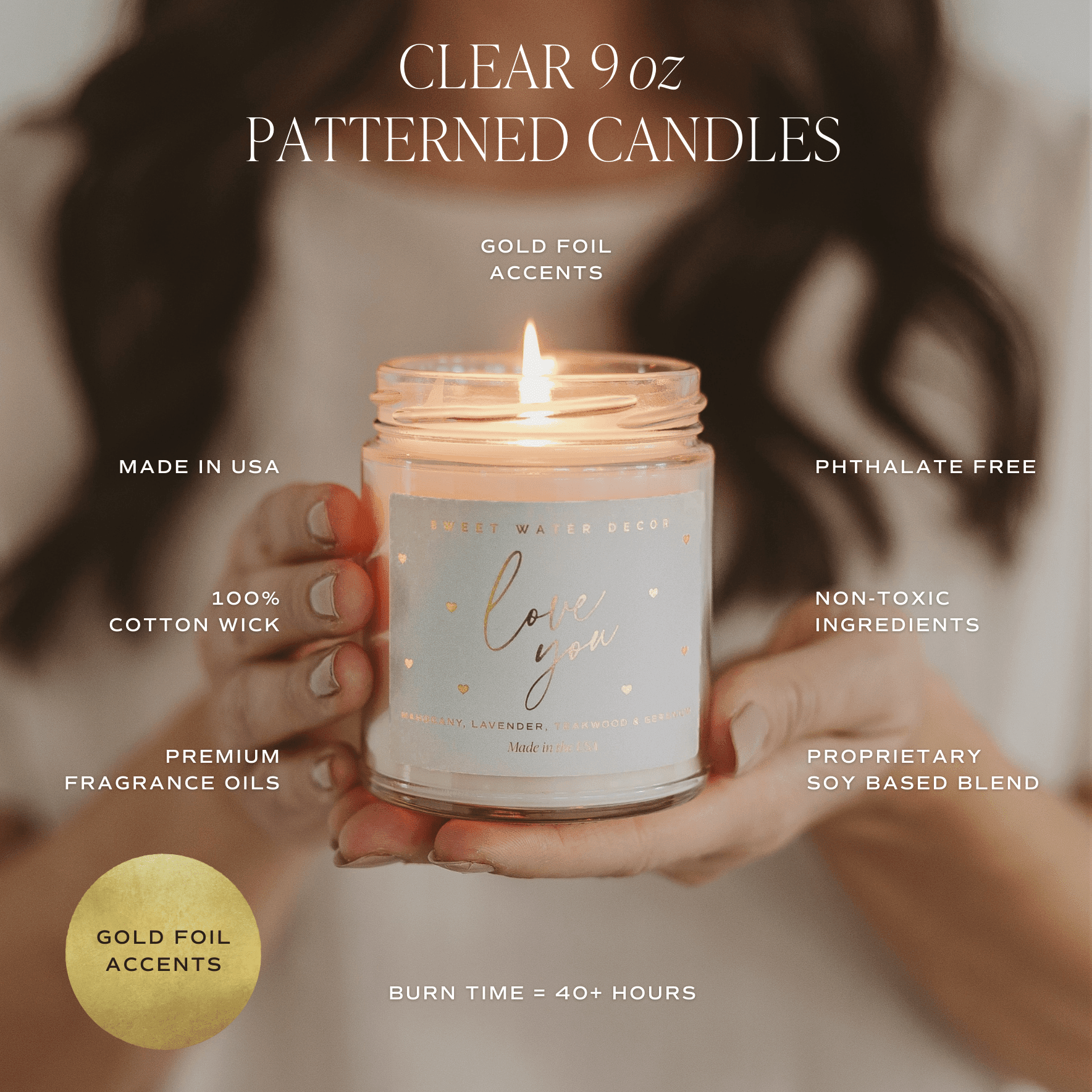 Clear 9oz soy candle jar with gold foil "love you" text design, held in hands with lit cotton wick, showing product features and burn time details.