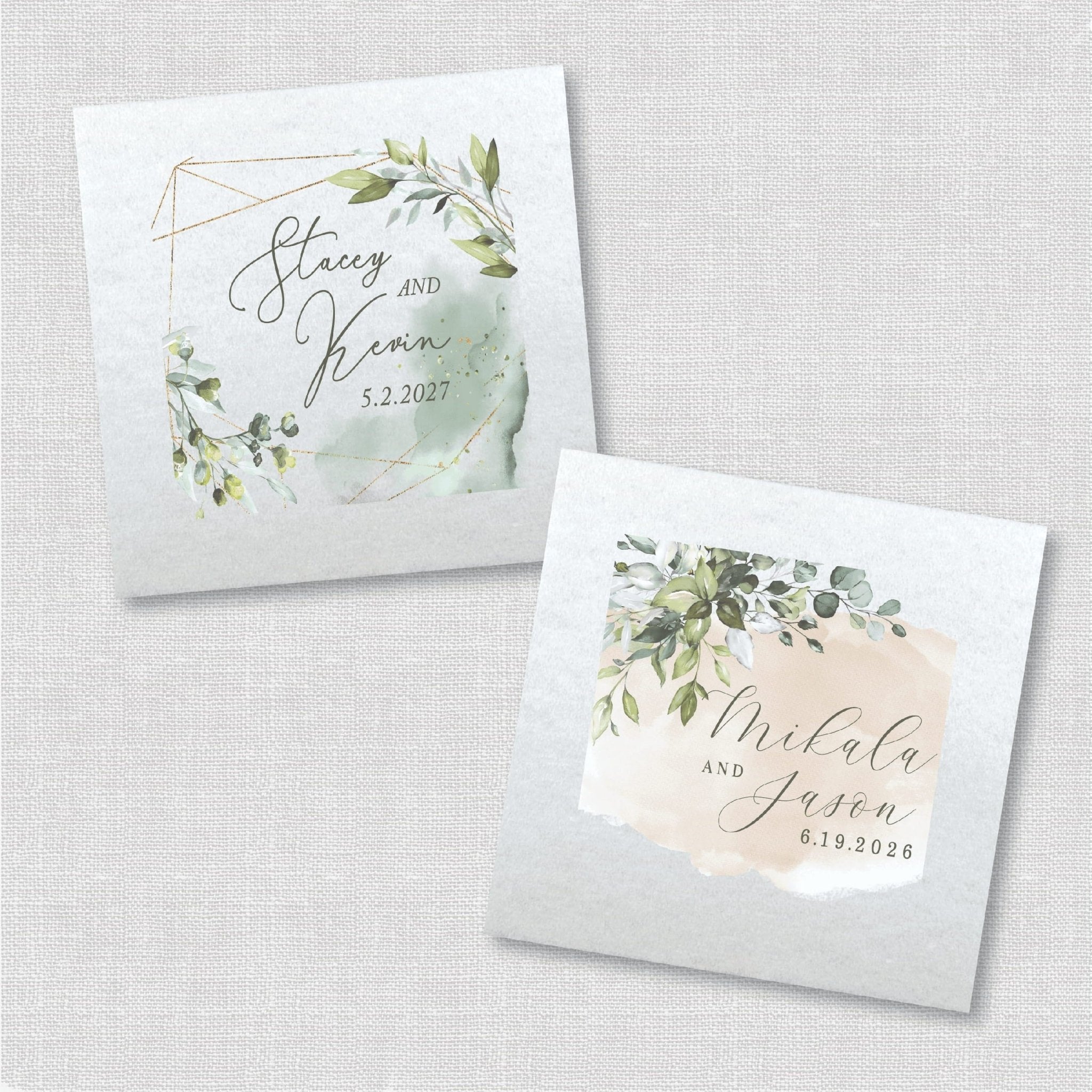 White napkins with greenery watercolor designs and personalized couple names with wedding dates printed in script