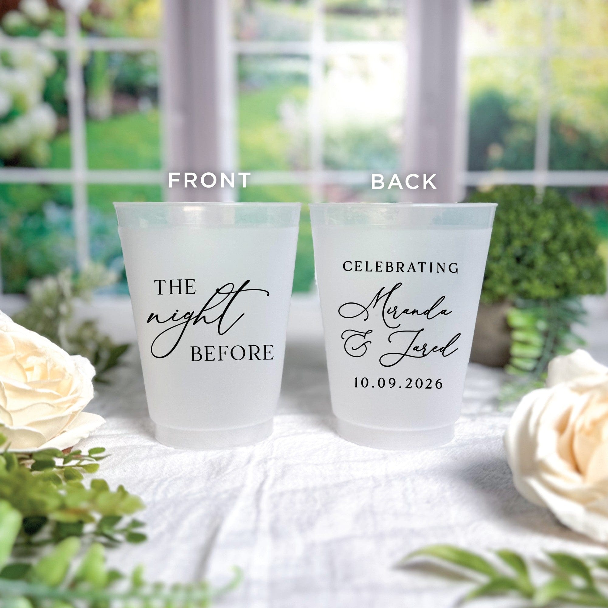 Two personalized frosted white plastic cups for wedding celebrations, featuring custom black script text on both the front and back.