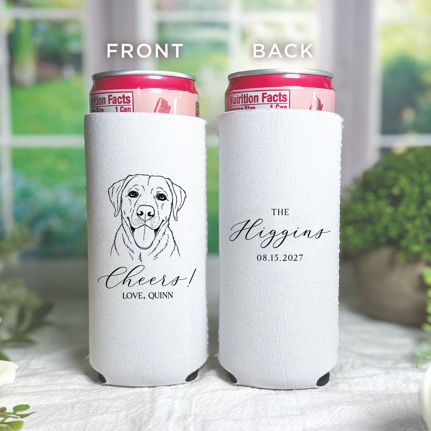 A pair of white fabric can coolers, one for a regular can and one for a slim can, are custom printed with a black line art dog illustration and elegant script, ideal for a wedding or special event.