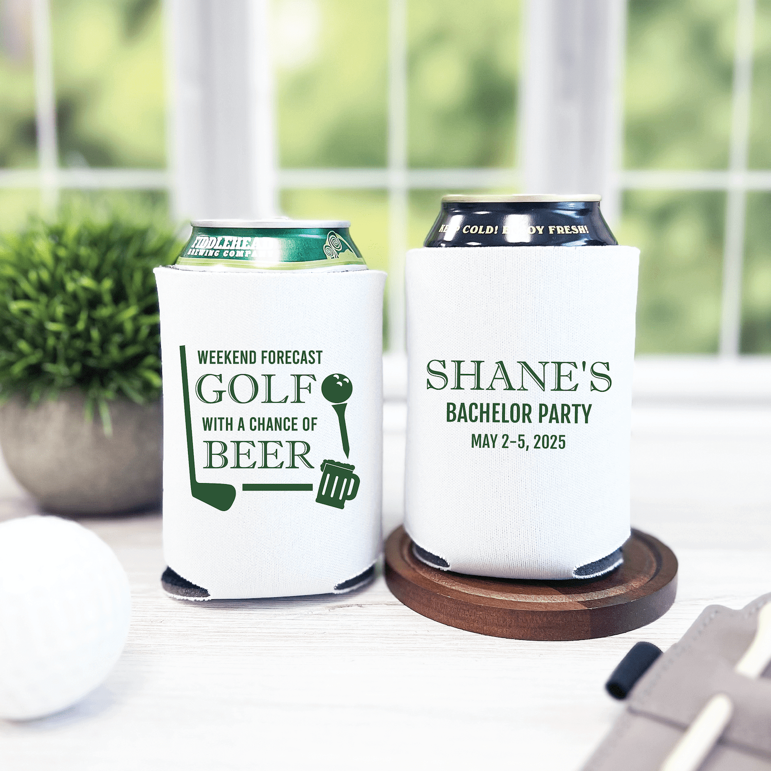 White neoprene can coolers with golf and bachelor party designs, one reading "Weekend Forecast Golf With A Chance of Beer" and the other "Shane's Bachelor Party May 2-5, 2025"