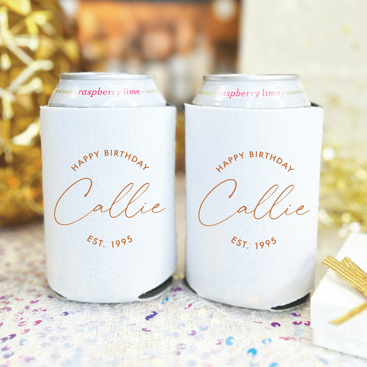 White can coolers with rose gold "Happy Birthday Callie EST. 1995" text, displayed as a pair with festive confetti and gold accents