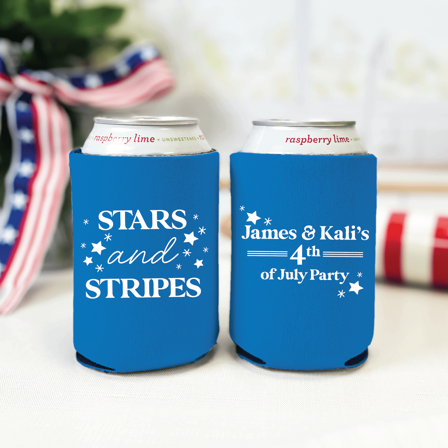 Pair of blue neoprene can coolers with white stars and personalized "Stars and Stripes" and "James & Kali's 4th of July Party" text for beer cans.