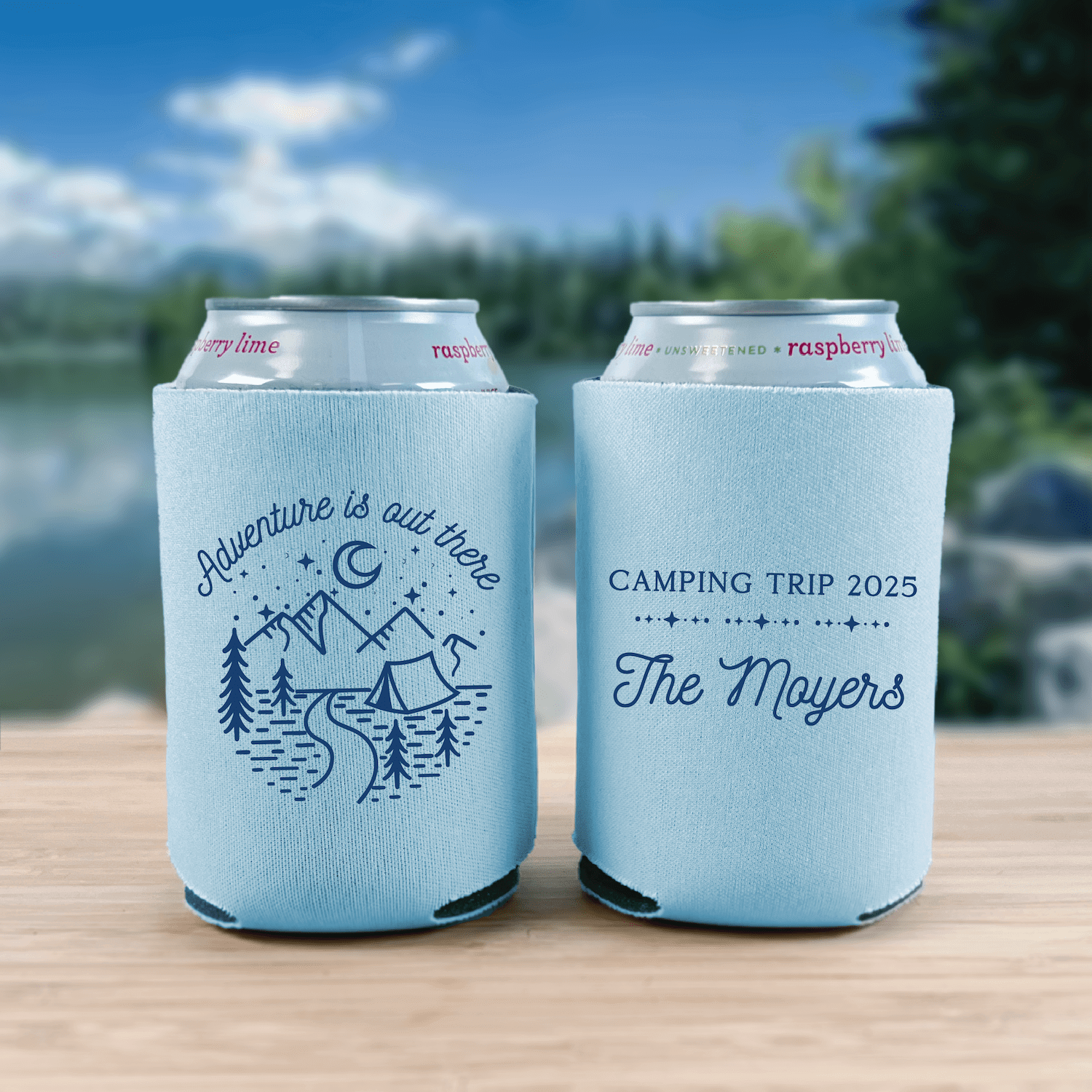 Light blue can coolers with adventure design on front and "Camping Trip 2025 The Moyers" personalization on back
