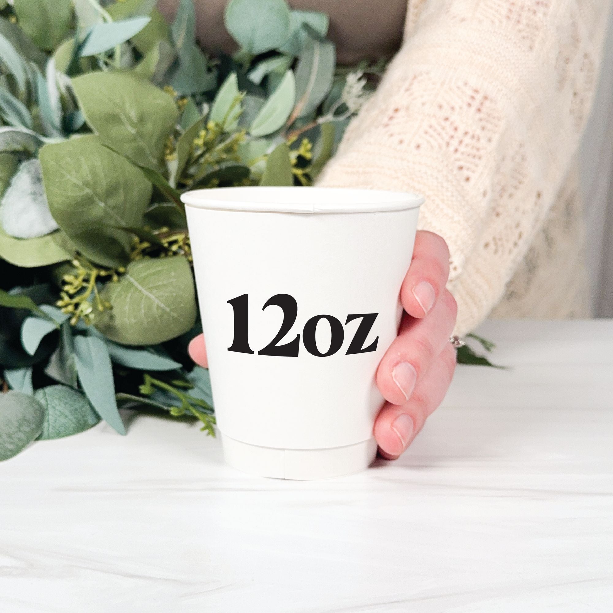 Personalized Paper Wedding Cups Design Your Own 12oz held in hand with eucalyptus greenery – Rubi and Lib