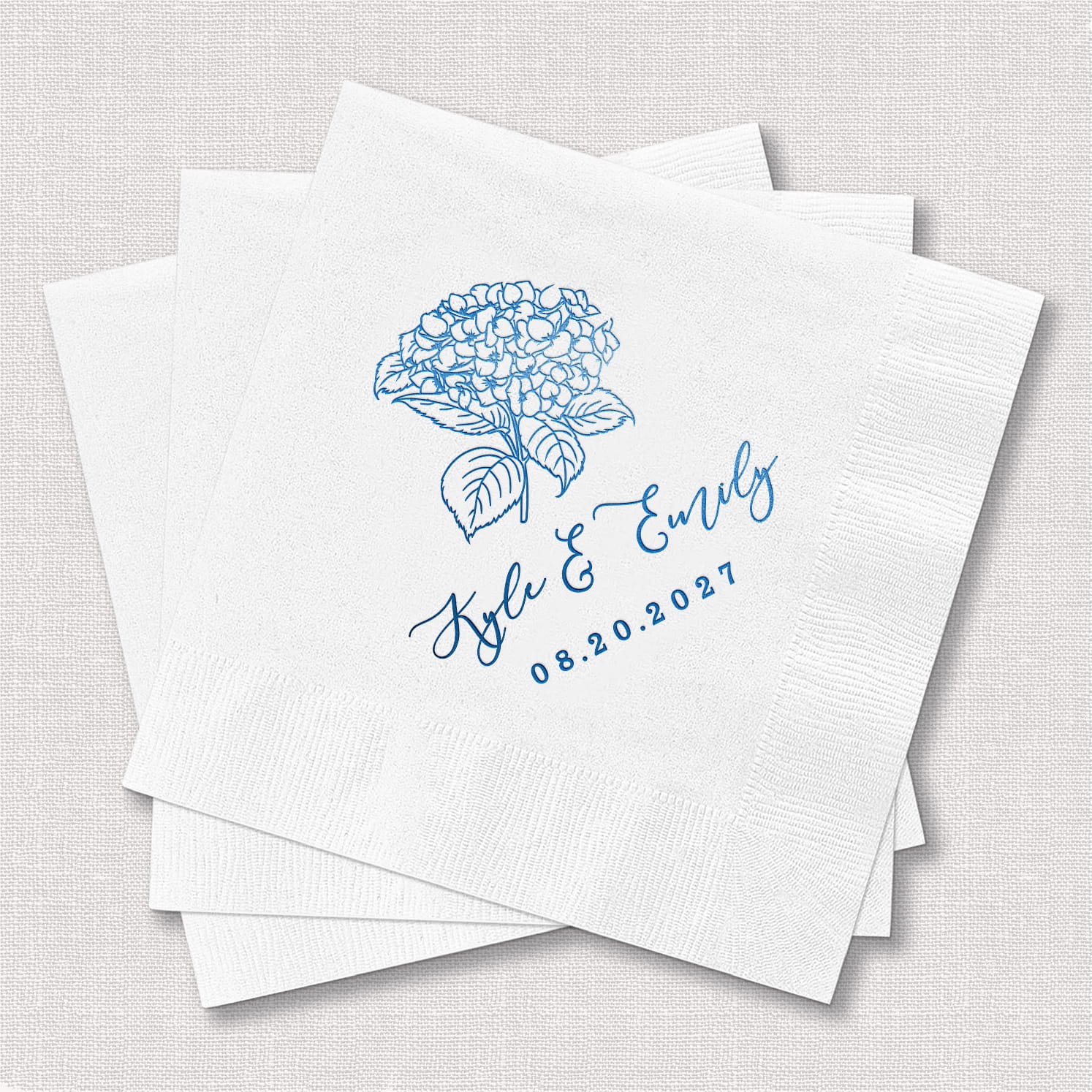 A product photo of a personalized cocktail napkin from the Hydrangea Wedding Bundle, featuring a hydrangea floral design on soft 3-ply paper stock.