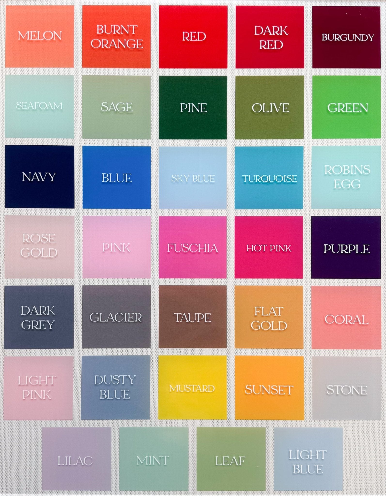 Swatch chart of UV print color samples available for custom acrylic wedding signs, ranging from melon and burnt orange to navy, turquoise, and dusty blue.