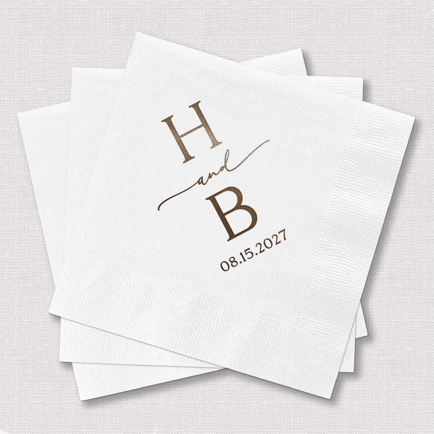 A product photo of a personalized cocktail napkin featuring a modern initial monogram, styled against a clean background for the Modern Initial Wedding Bundle.