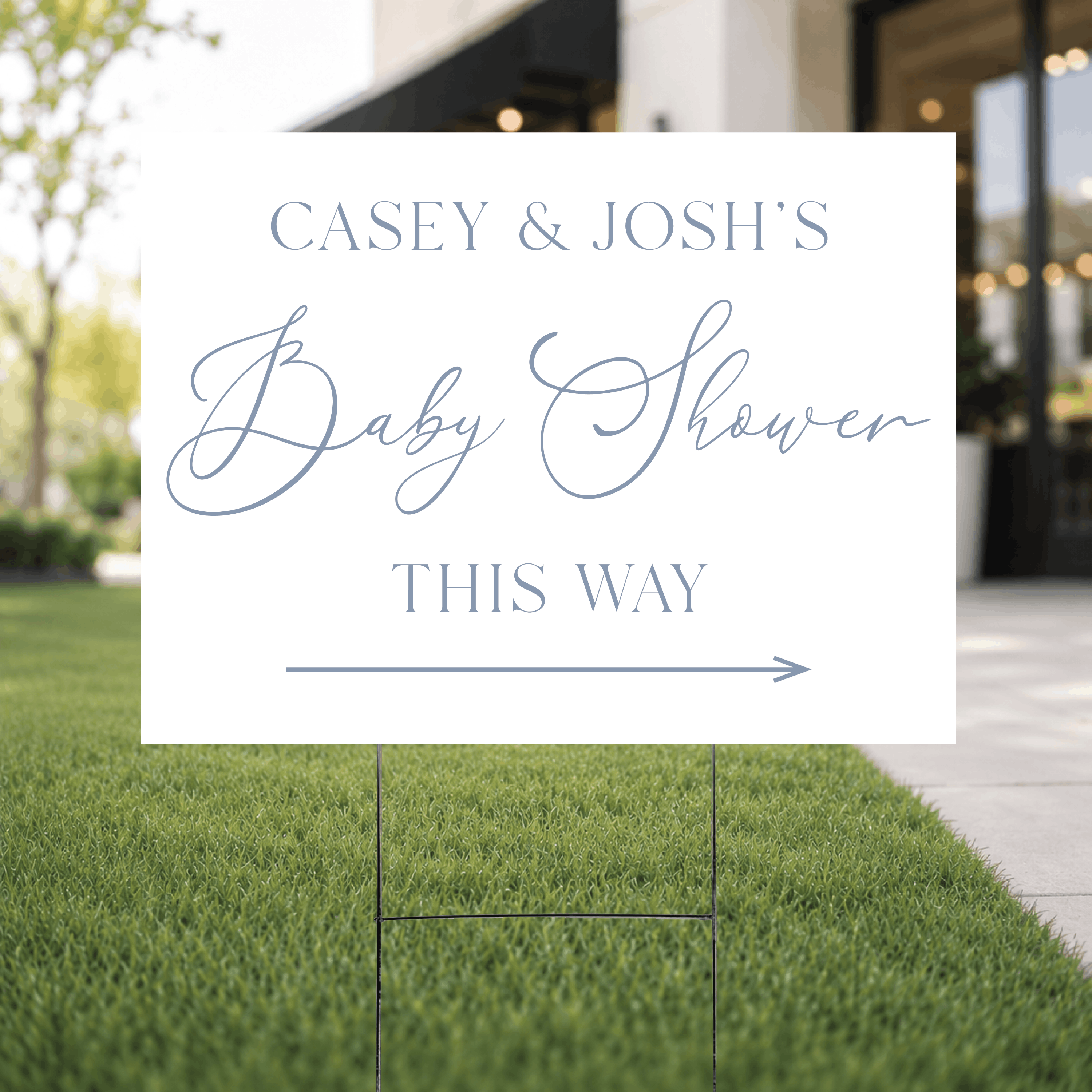 Close-up of a modern script baby shower directional yard sign showing the clean white background with custom UV ink name and arrow in elegant mixed typography.