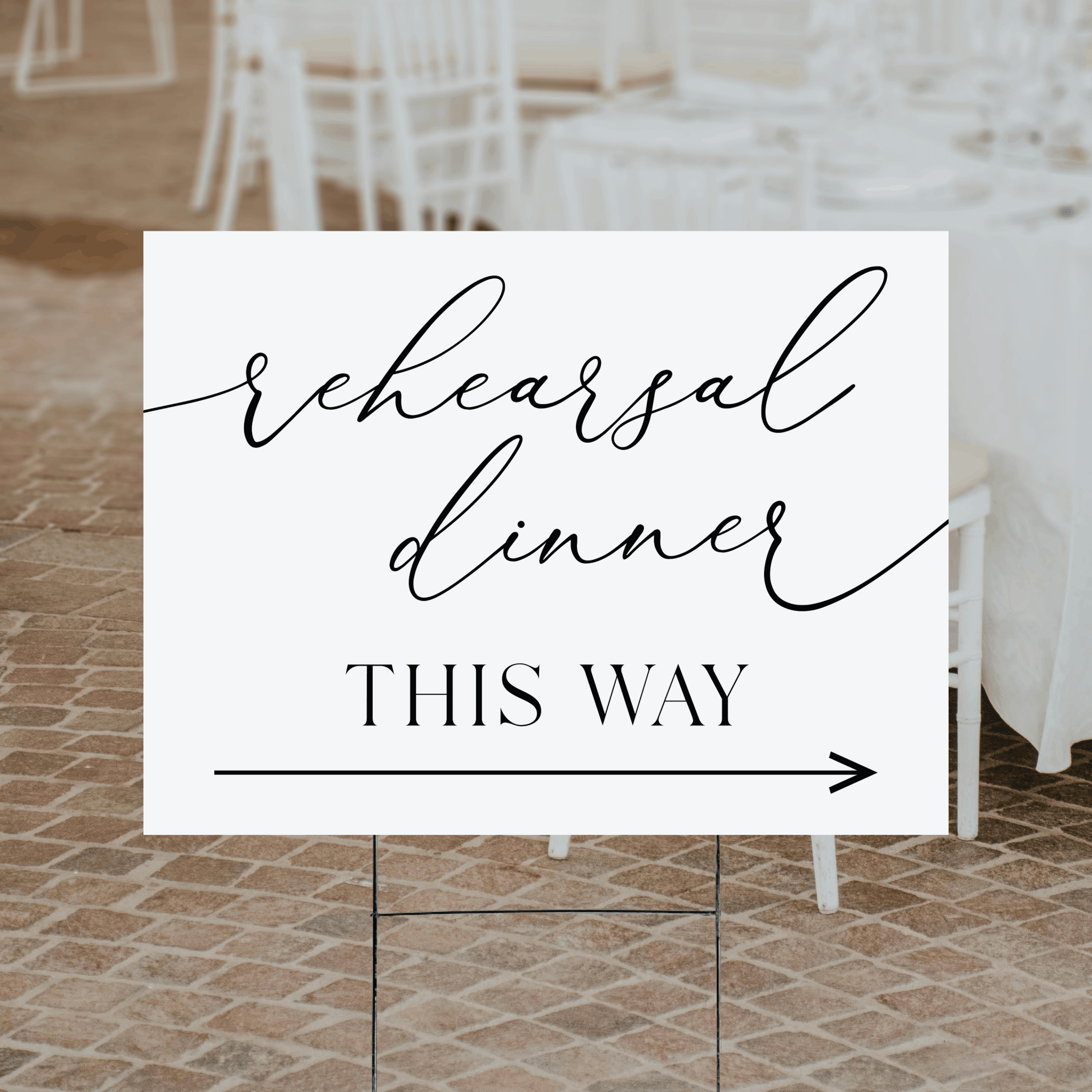 Modern script rehearsal dinner directional yard sign — flowing script and serif typography with arrow on white background