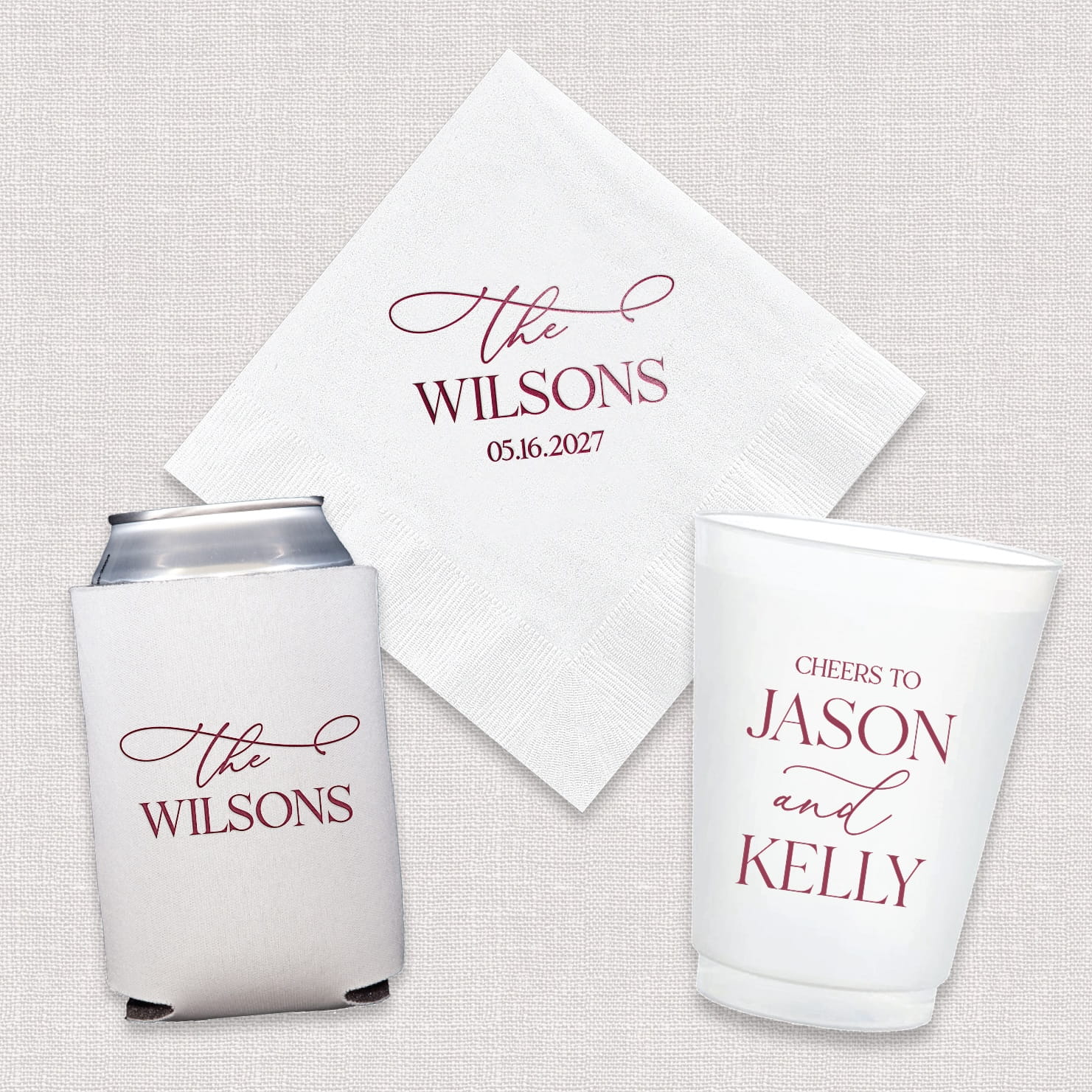 A complete Elegant Last Name wedding bundle featuring personalized cocktail napkins, frosted shatterproof cups, and neoprene can coolers displayed together as a coordinated set.