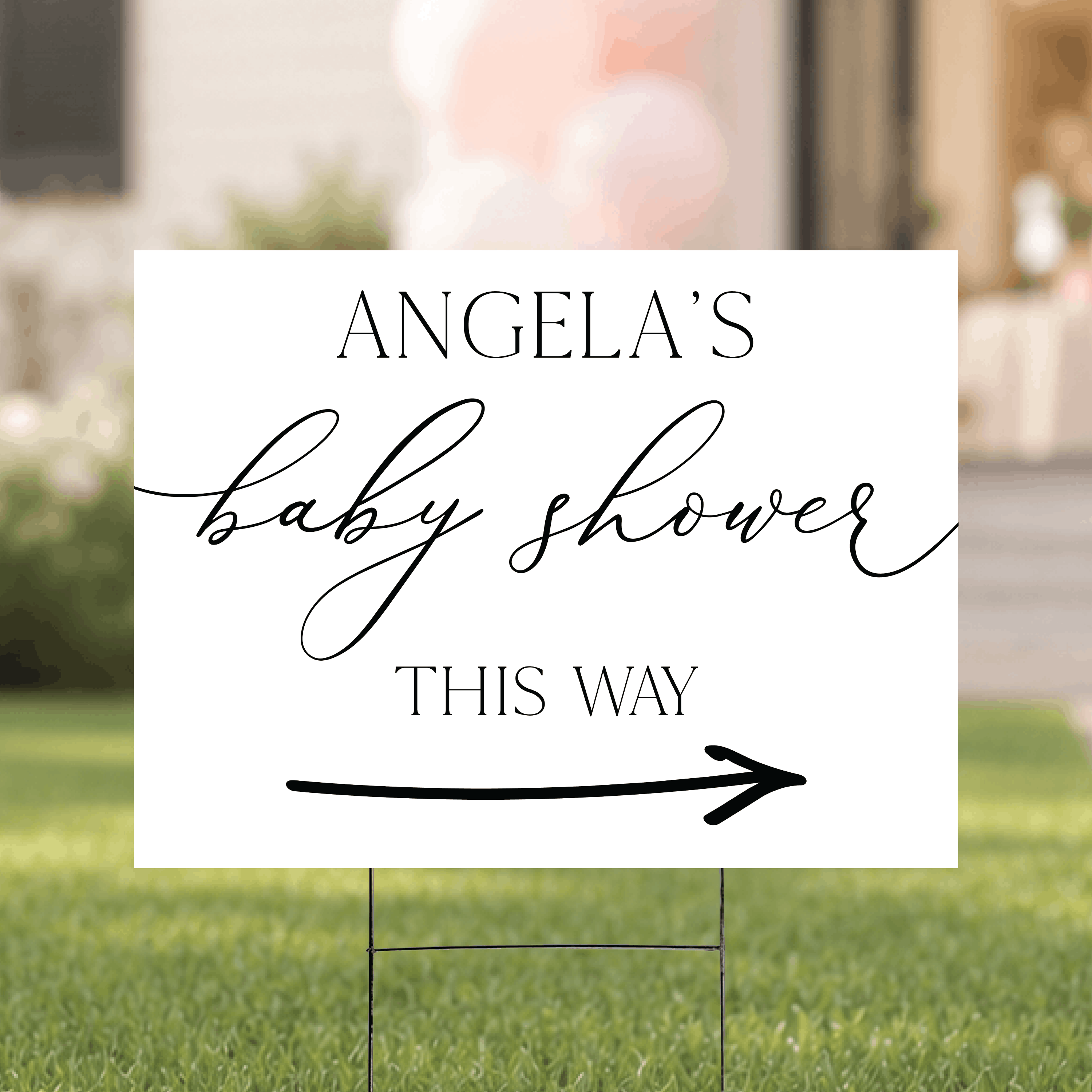 Personalized baby shower yard sign with name and directional arrow, shown staked in grass for an outdoor baby shower venue.