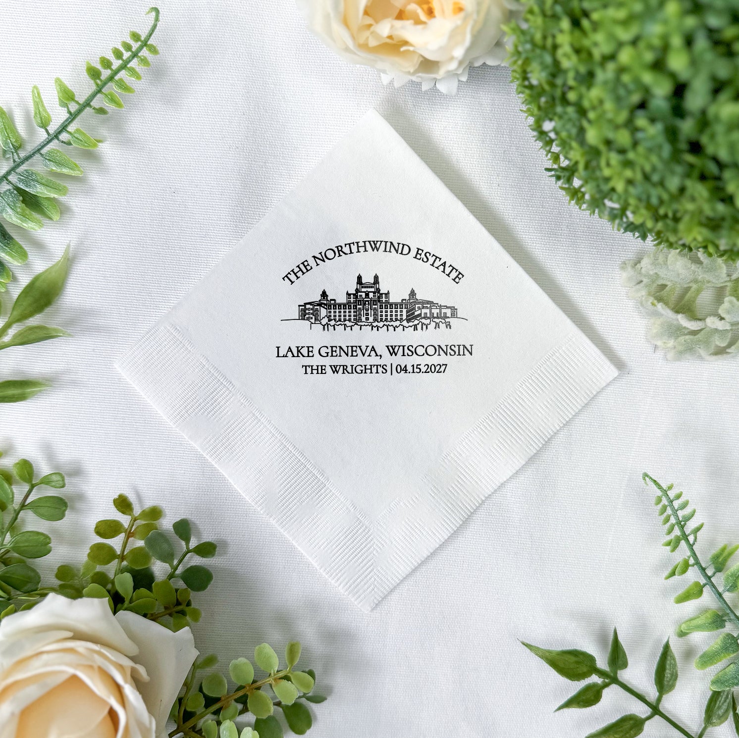 Personalized cocktail napkins with venue line drawing design showing couple's initials, venue name, and wedding date